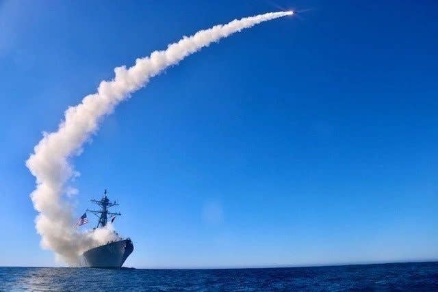 The guided-missile destroyer USS<em> Chafee</em> (DDG 90) launches a Block V Tomahawk, the weapon’s newest variant, during a three-day missile exercise in December 2020. This event marked the first time a Block V Tomahawk missile was operationally tested. <em>U.S. Navy photo by Ens. Sean Ianno/Released</em>