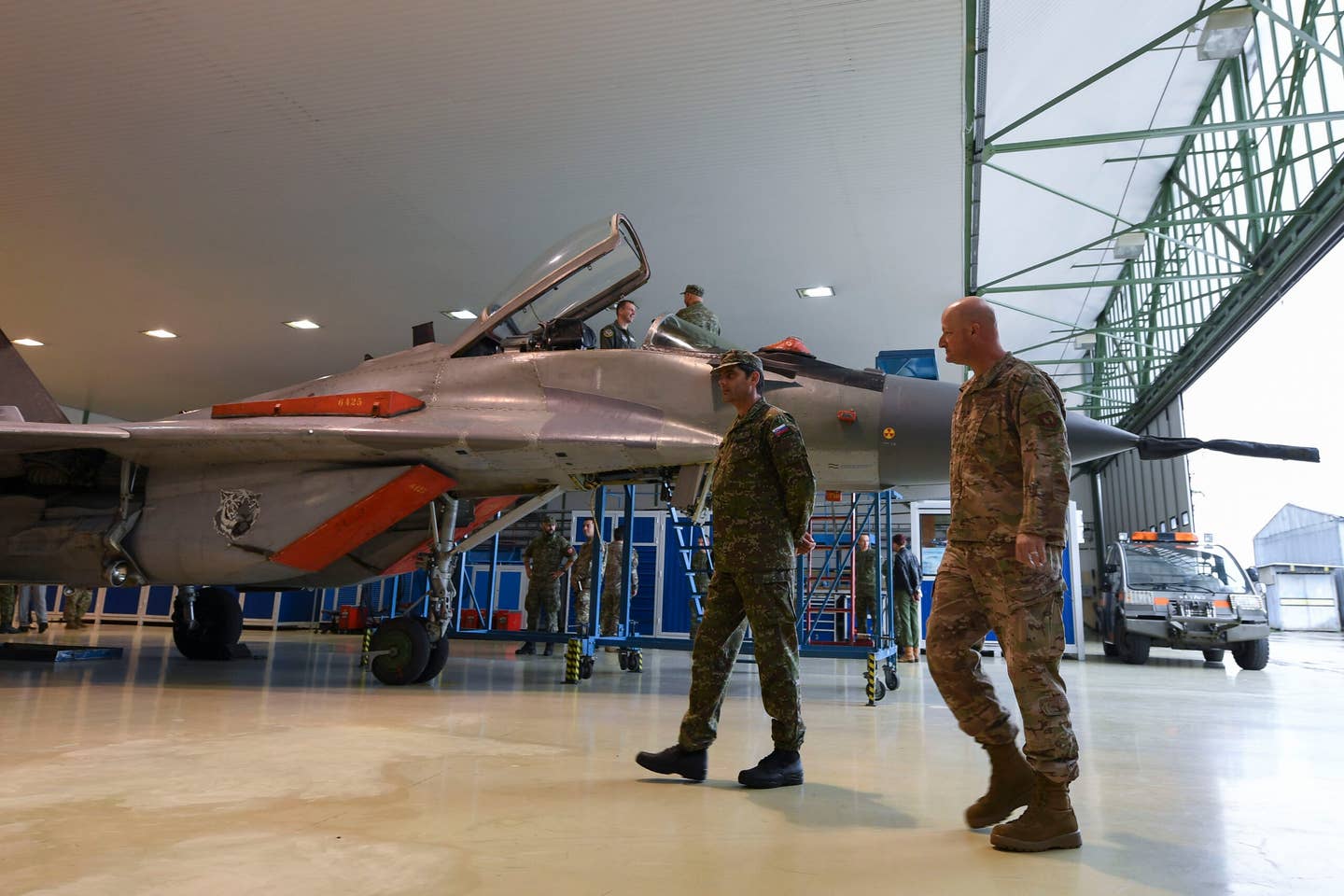 Slovak Air Force Maj. Peter Krajňák, left, Tactical Wing Sliac chief of air engineer services, and U.S. Air Force Brig. Gen. Christopher J. Ireland, U.S. Air Forces in Europe and Air Forces Africa chief of staff, walk around a Slovak MiG-29 during a tour at Sliač Air Base, Slovakia, in 2020. <em>U.S. Air Force photo by Staff Sgt. Savannah L. Waters</em><br>