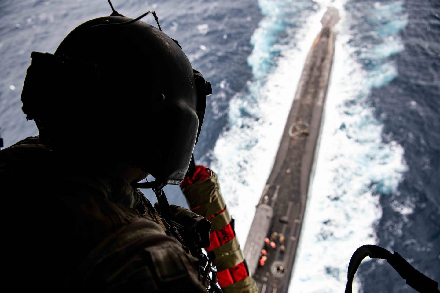 A Navy SEAL overlooks USS <em>Florida</em> from the CV-22 Osprey. <em>U.S. Air Force photo by Tech Sgt. Westin Warburton</em>