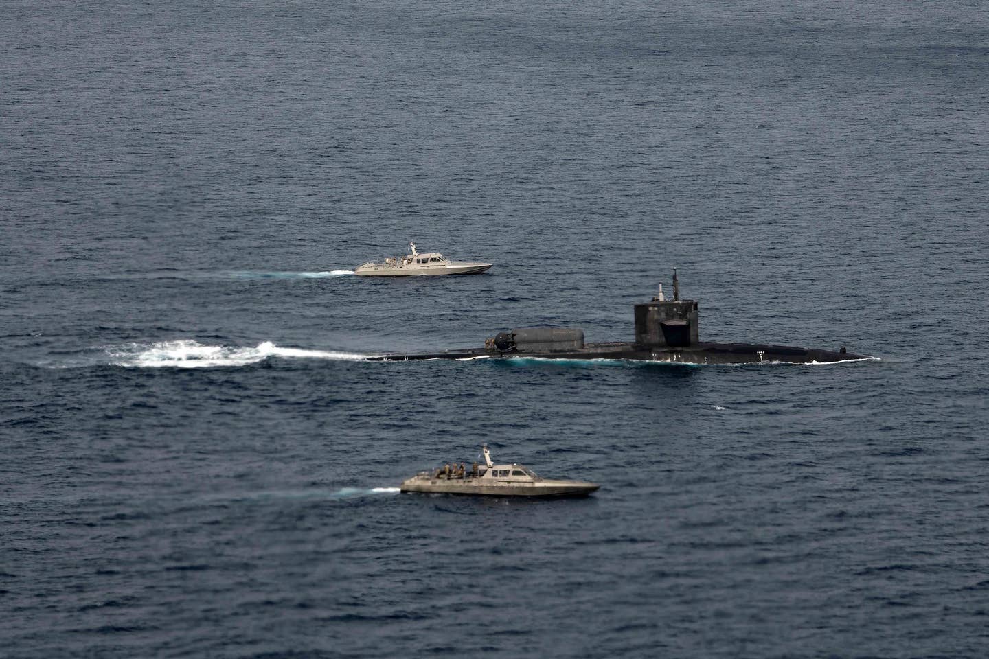 USS <em>Florida</em> accompanied by NATO special operations forces MK-V patrol boats. <em><em>U.S. Air Force photo by Tech Sgt. Westin Warburton</em></em>