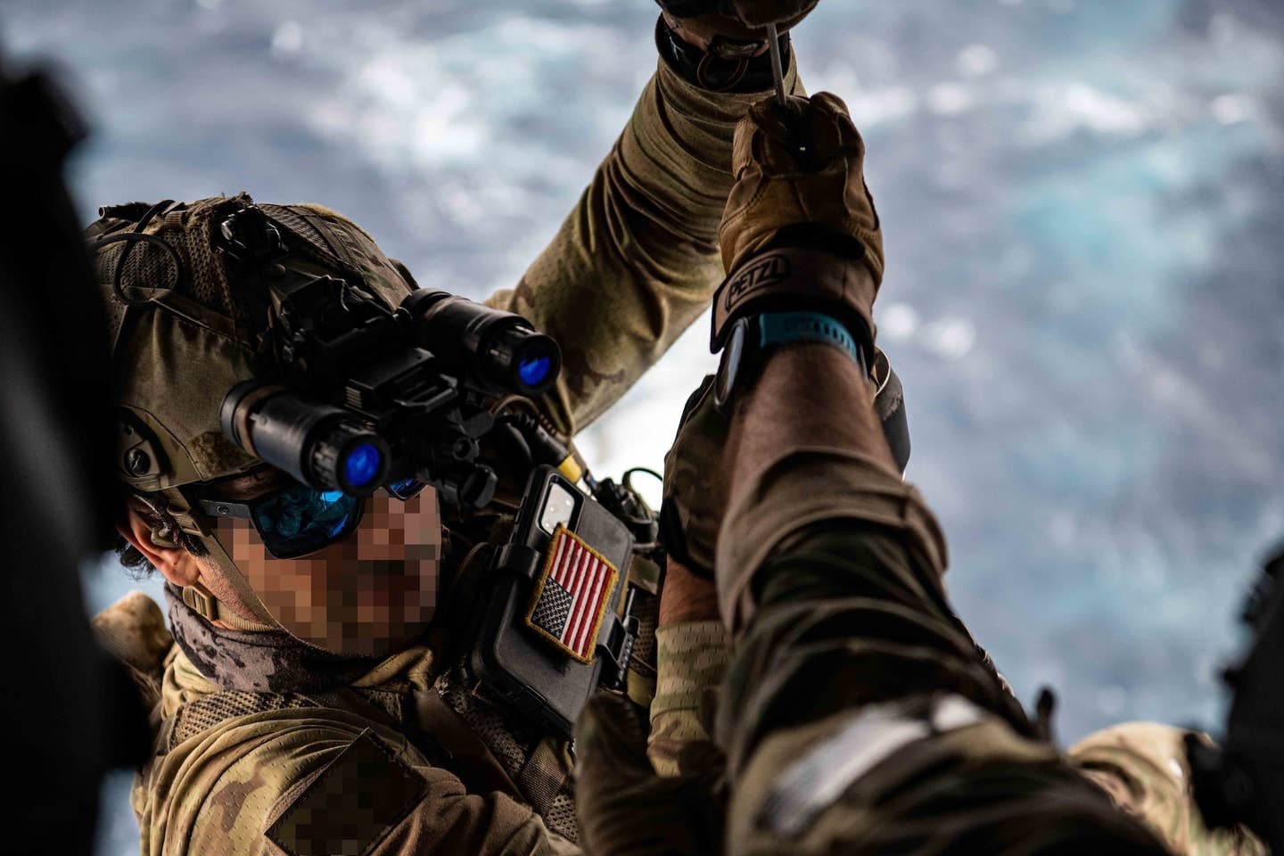 A Navy SEAL. Note the phone-sized tablet with a U.S. flag patch attached to its back. <em><em>U.S. Air Force photo by Tech Sgt. Westin Warburton</em></em>