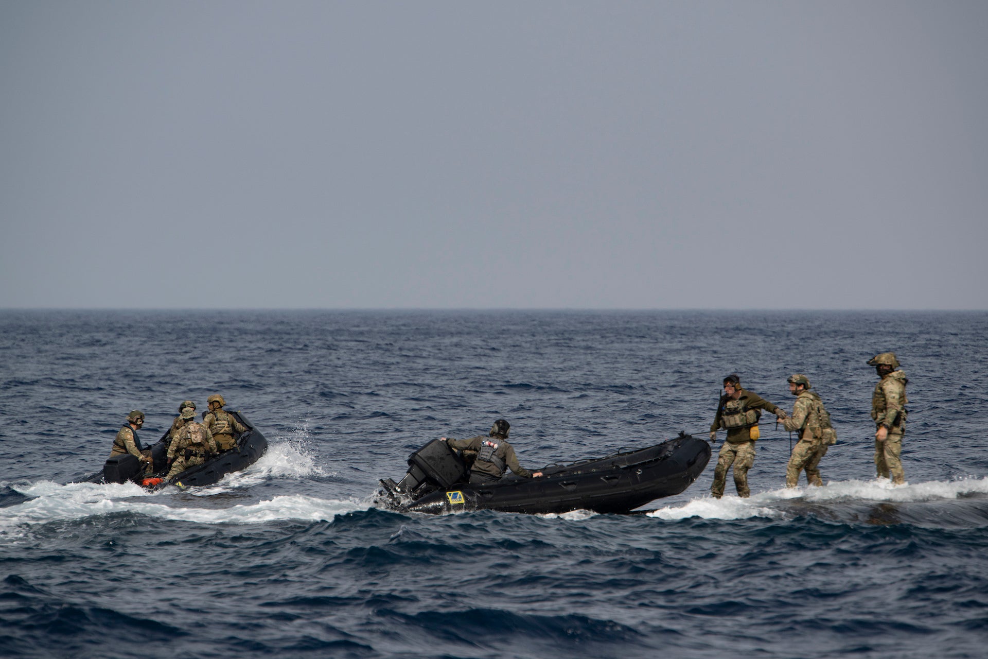 MEDITERRANEAN SEA (Feb. 27, 2023) East-Coast-based U.S. Naval Special Warfare Operators (SEALs) and NATO special operations forces partners land a combatant rubber raiding craft (CRRC) aboard Ohio-class guided-missile submarine USS Florida (SSGN 728) during a special operations forces interoperability exercise, Feb. 27, 2023. These  operations demonstrate U.S. European Command’s ability to rapidly deploy Special Operations Forces throughout the theater at a time and place of our choosing, and the U.S. commitment to train with Allies and partners to deploy and fight as multinational forces and SOF to meet today’s challenges. (U.S. Navy photo by Mass Communications Specialist 2nd Class Matthew Dickinson)