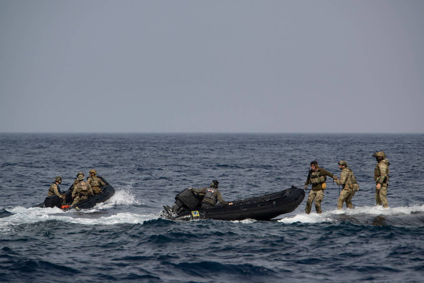 Navy SEALs and Greek Special Operations Forces (SOF) landing a Combat Rubber Raiding Craft (CRRC) aboard USS <em>Florida</em>.<em> U.S. Navy photo by Mass Communications Specialist 2nd Class Matthew Dickinson  </em>