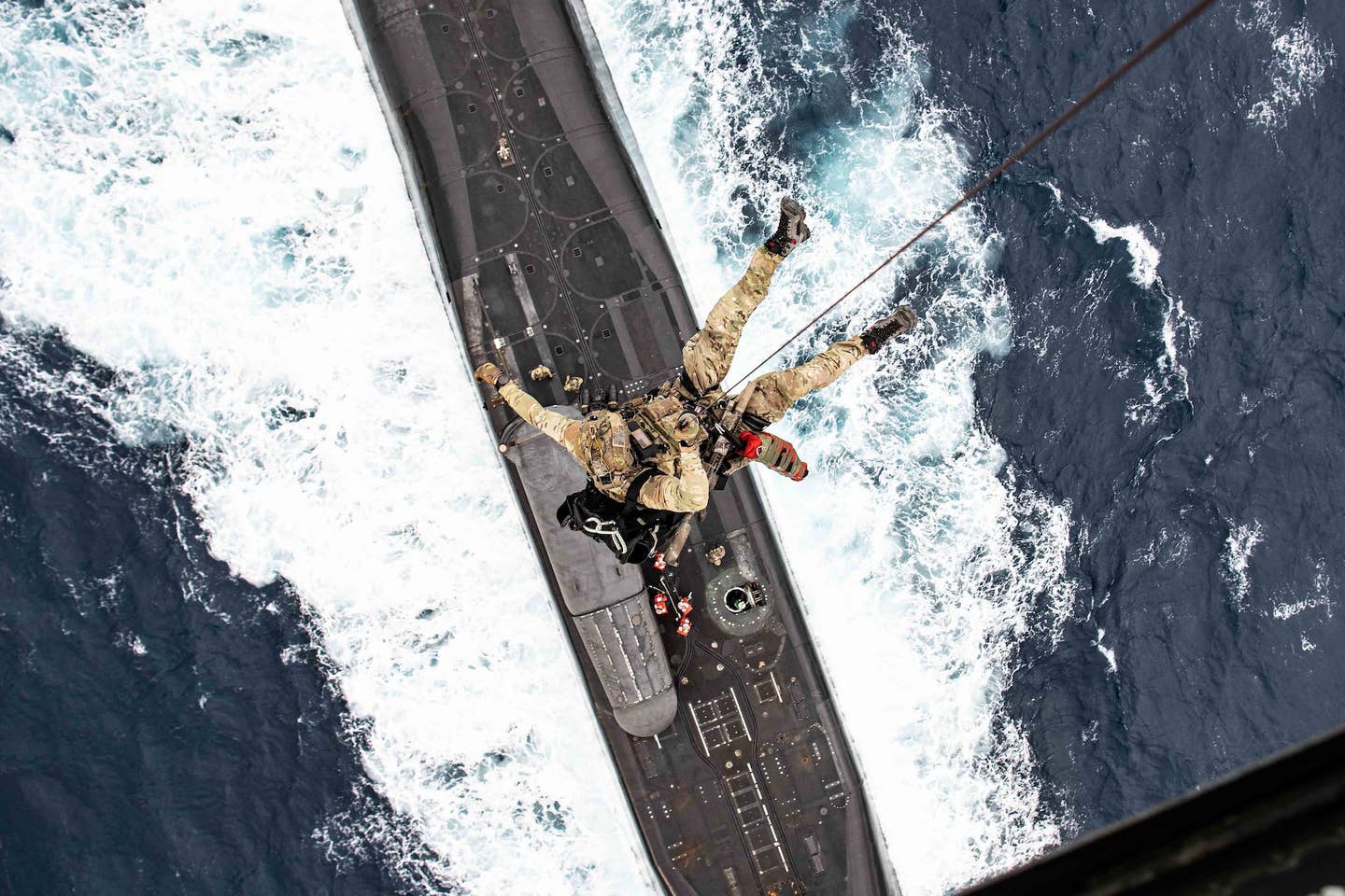 Navy SEAL being winched. <em><em>U.S. Air Force photo by Tech Sgt. Westin Warburton</em></em>