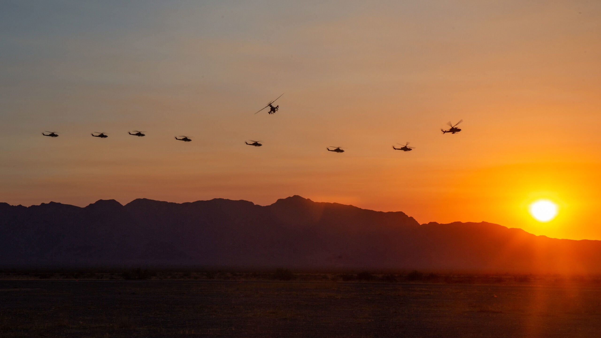 U.S. Marine Corps AH-1Z Vipers, assigned to Marine Aviation Weapons and Tactics Squadron One (MAWTS-1), fly to a forward arming and refueling point during Weapons and Tactics Instructor (WTI) course 1-21, at Stoval Airfield, Dateland, Arizona, Oct. 16, 2020. The WTI course is a seven-week training event hosted by MAWTS-1, providing standardized advanced tactical training and certification of unit instructor qualifications to support Marine aviation training and readiness and assists in developing and employing aviation weapons and tactics. (U.S. Marine Corps photo by Sgt. Alexander N. Sturdivant)