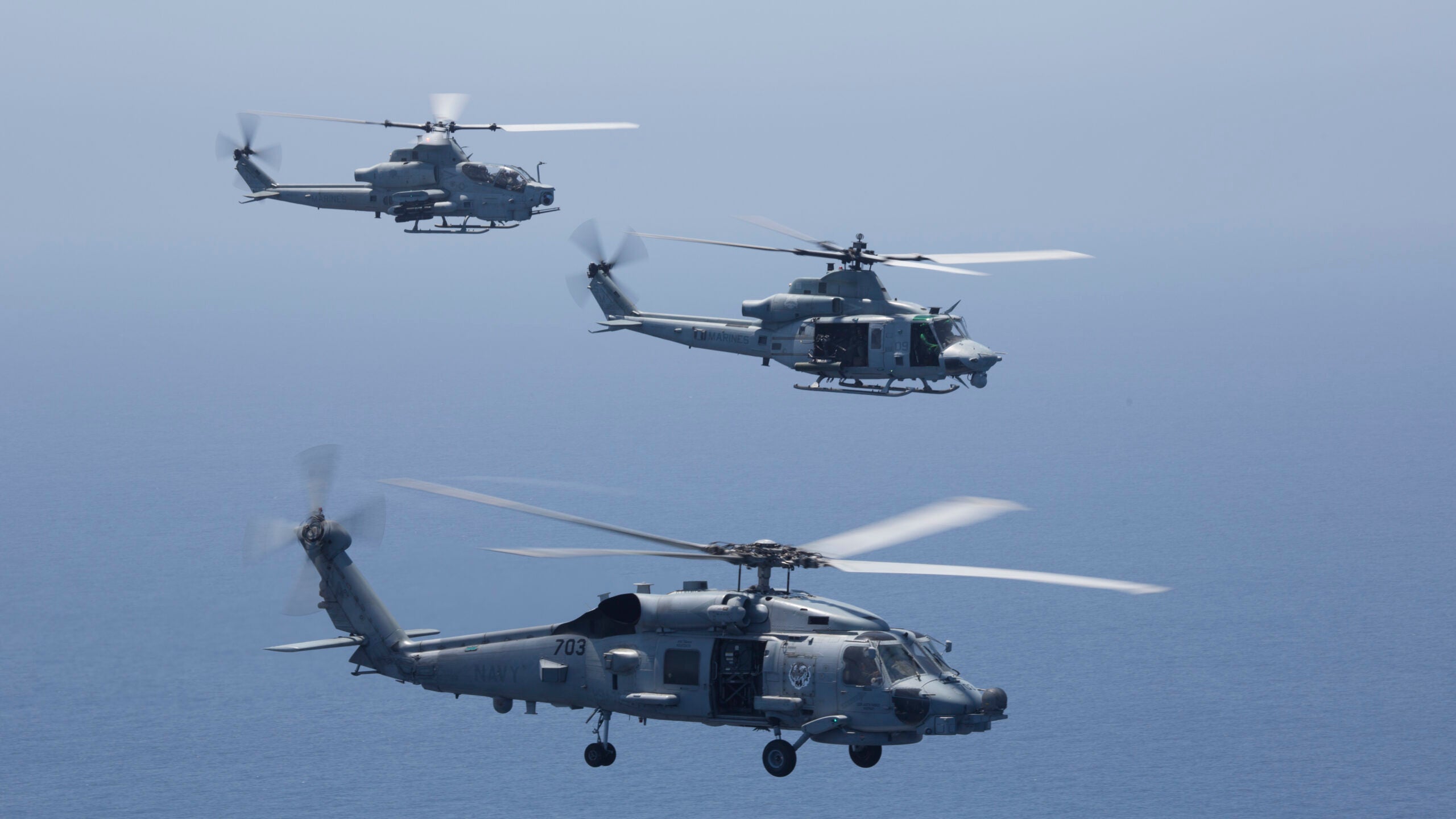 U.S. Marine Corps aircraft from Marine Light Attack Helicopter Squadron (HMLA) 267, and HMLA-369, Marine Aircraft Group 39, 3rd Marine Aircraft Wing (MAW), drop sonobouys to receive signals from a submarine in the Pacific Ocean, July 20, 2021. 3rd MAW focuses on rapidly establishing forward operating bases across a broad area from which they can conduct various missions and then disestablishing them just as quickly, relocating, and repeating the process elsewhere; to include anti-submarine warfare. Summer Fury is an exercise conducted by 3rd MAW in order to maintain and build capability, strength and trust within its units to generate the readiness and lethality needed to deter and defeat adversaries during combat operations as the U.S. Marine Corps refines tactics and equipment in accordance with Force Design 2030. (U.S. Marine Corps photo by Lance Cpl. Rachaelanne Woodward)