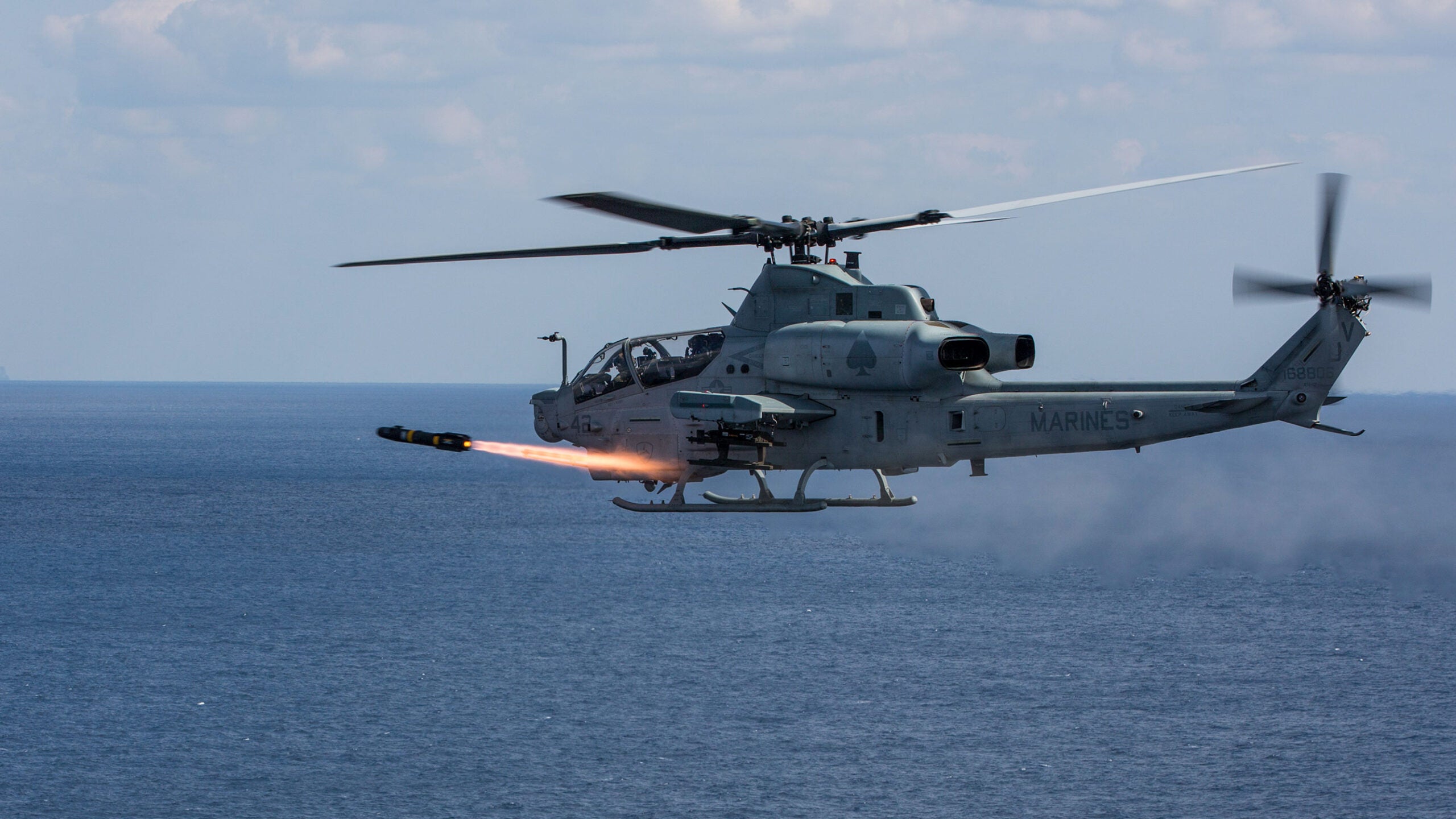 An AH-1Z Viper with Marine Light Attack Helicopter Squadron (HMLA) 267, 3rd Marine Aircraft Wing, fires an AGM-114 Hellfire missile at Range 176, Okinawa, Japan, Feb. 14, 2017. HMLA 267 conducted a live fire drill off the coast of Okinawa to demonstrate the capabilities of the AH-1Z Viper helicopter. (U.S. Marine Corps photo by MCIPAC Combat Camera Lance Cpl. Sean M. Evans)