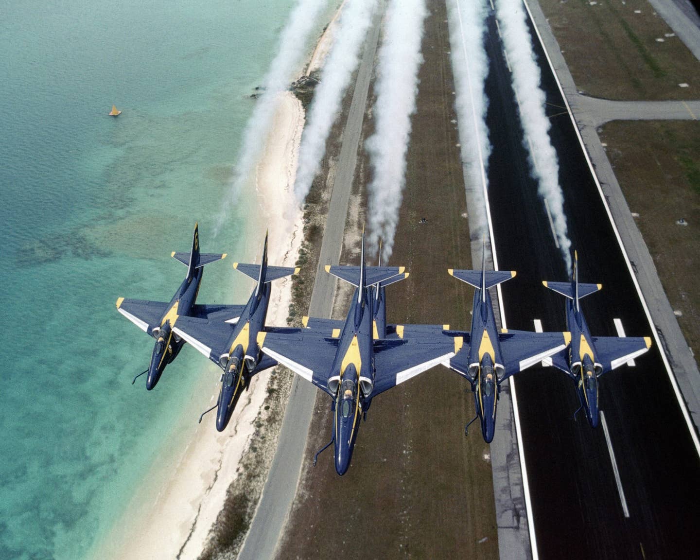 The six A-4Fs of the U.S. Navy Blue Angels flight demonstration in a tight wedge formation, in July 1984. <em>U.S. Navy</em>
