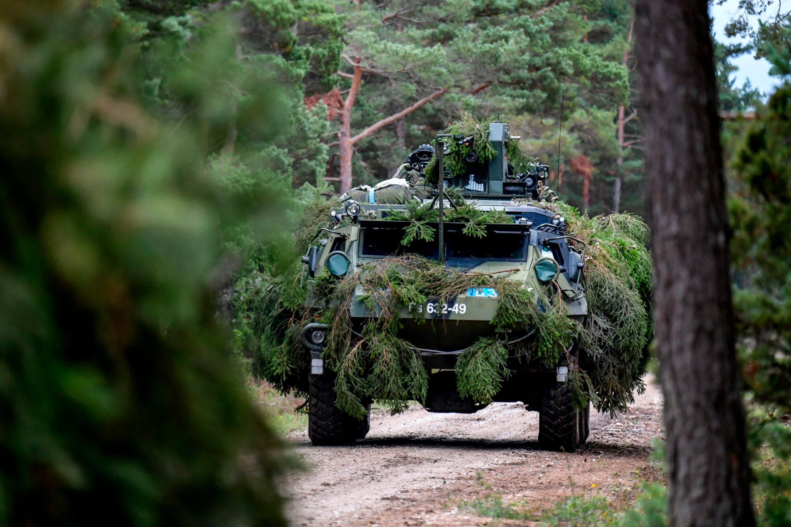 TOPSHOT - A Finnish armored terrain vehicle, Patria, is seen during a co-operation between Finnish and Swedish troops at Tofta shooting field on the Swedish island Gotland on September 19, 2017 during the ongoing military exercise Aurora 17.

Sweden kicks off with Aurora 17 its first and largest defence exercise in 20 years on the island of Gotland in the Baltic Sea. / AFP PHOTO / TT News Agency / Anders WIKLUND / Sweden OUT        (Photo credit should read ANDERS WIKLUND/AFP via Getty Images)