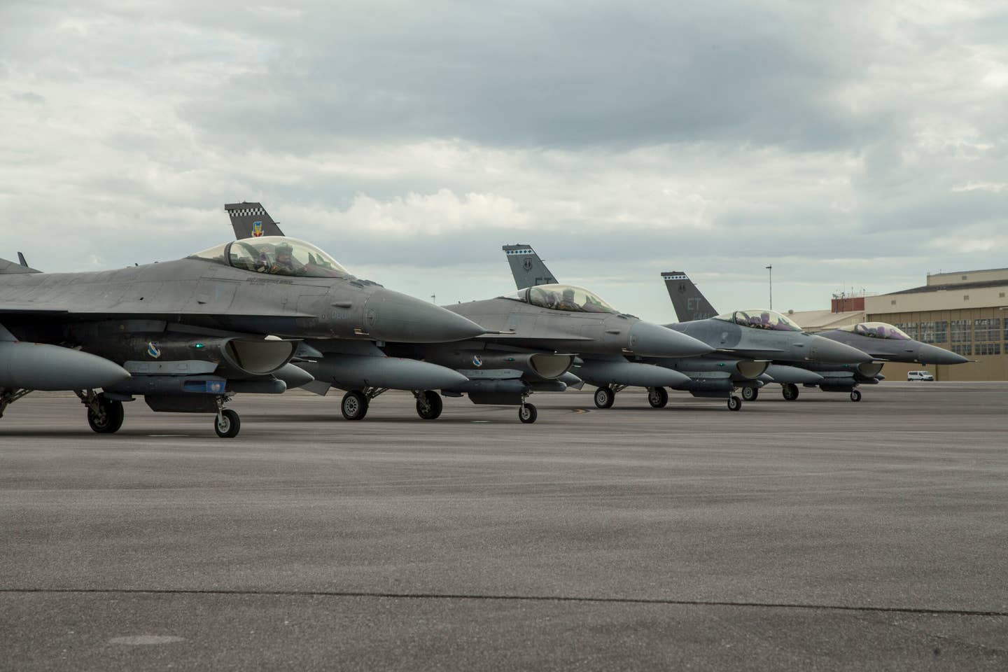 Four F-16 Fighting Falcons from the 96th Test Wing and the 53rd Wing stand ready for takeoff at Eglin Air Force Base, Fla., July 2, 2020. <em>Credit: U.S. Air Force photo by Master Sgt. Tristan McIntire</em>