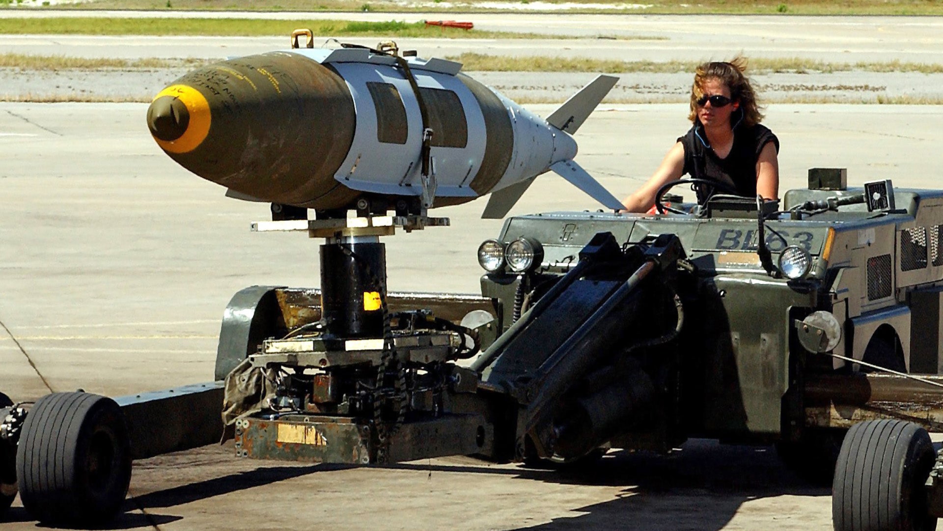 An Air Force load crewmember from the 28th Air Expeditionary Wing, maneuvers an MHU-83 C/E Munitions Loader with a 2,000-pound Joint Direct Attack Munition (JDAM) based on a Mk-84 bomb to be loaded on a B-1B Lancer during Operation ENDURING FREEDOM. Air Force B-2 Spirit, B-1 Lancer, and B-52 Stratofortress, bombers expended more than 80 percent of the tonnage dropped on combat missions over Afghanistan to date.  The Air Force flew more than 600 sorties including strike missions against al Qaeda and Taliban targets in Afghanistan. These targets include early-warning radar systems, ground forces, Command-and-Control facilities, al Qaeda infrastructure, airfields and aircraft. Operation ENDURING FREEDOM is in support of the Global War on Terrorism (GWOT), fighting terrorism abroad.