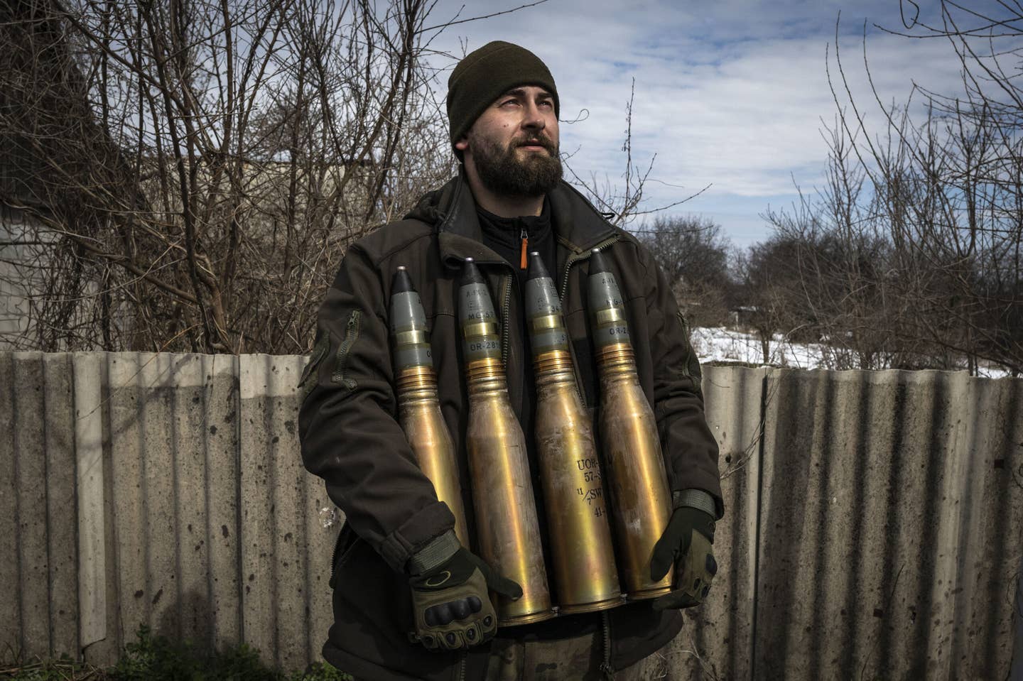 A Ukrainian soldier holds artillery ammunition near the frontline area amid the Russia-Ukraine war, in Bakhmut, Ukraine on April 2, 2023. <em>Photo by Muhammed Enes Yildirim/Anadolu Agency via Getty Images</em>
