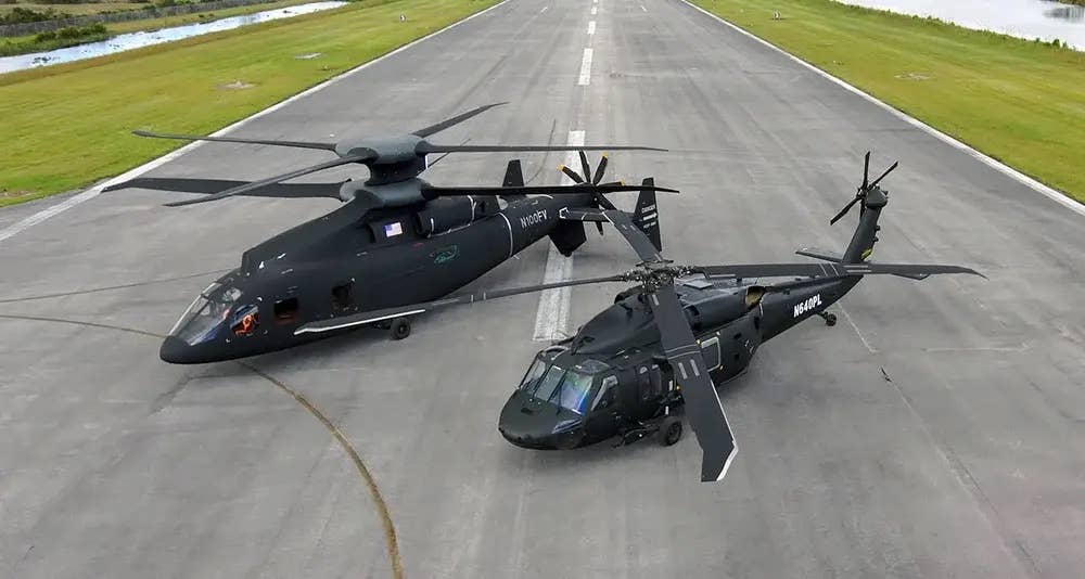 SB&gt;1 Defiant next to a UH-60 Black Hawk it intended on replacing. (Sikorsky)