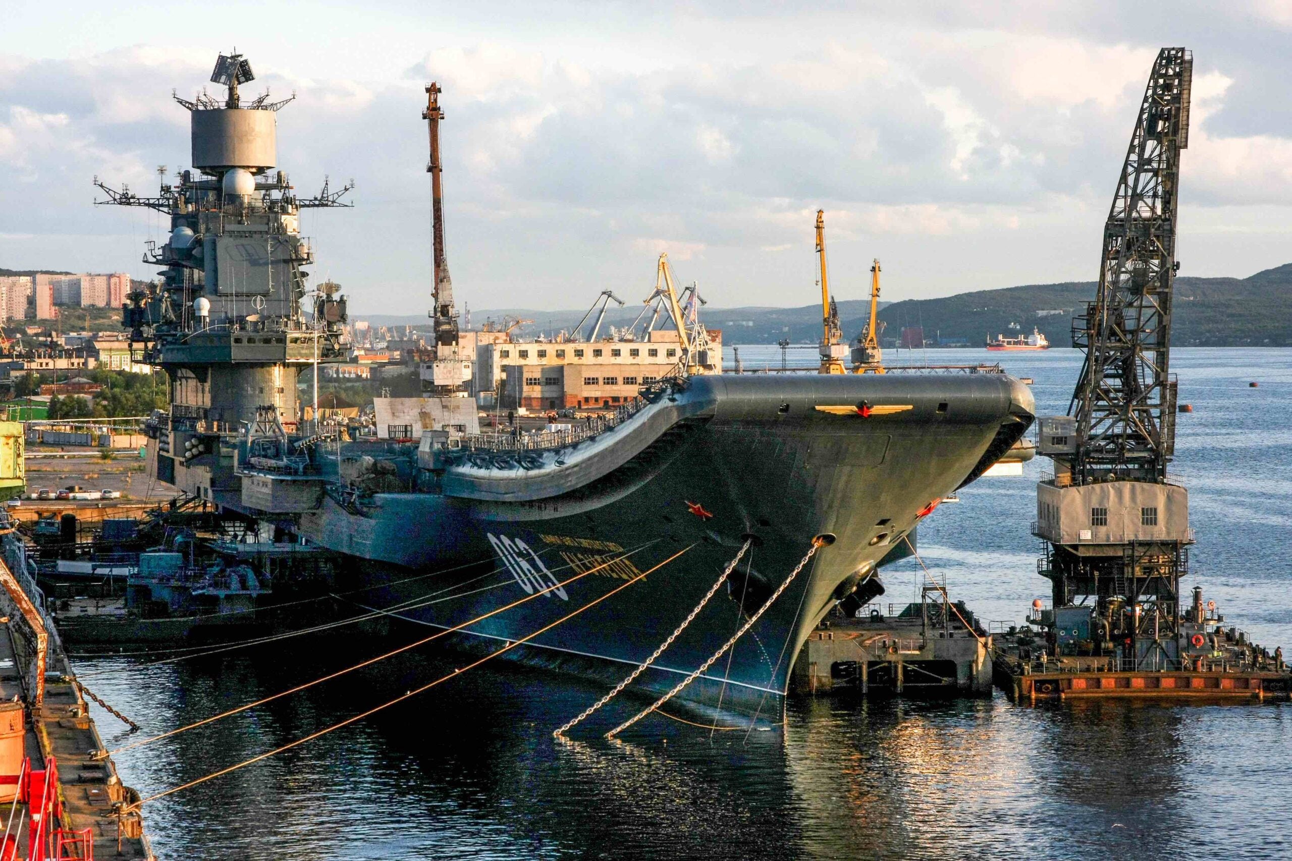 A picture taken on August 19, 2009 shows Russia's aircraft carrier Admiral Kuznetsov in Murmansk. - One person was missing and four others were injured on October 30, 2018 after a giant floating dock carrying Russia's only aircraft carrier Admiral Kuznetsov sunk at a shipyard near Russia's Arctic city Murmansk. The PD-50 floating dock -- one of the largest in the world and the largest in Russia -- sunk in the night of October 29, 2018 to October 30, 2018 after two cranes fell on it while the Soviet-era warship was undergoing repairs, local media reported. (Photo by Vasily MAXIMOV / AFP)        (Photo credit should read VASILY MAXIMOV/AFP via Getty Images)