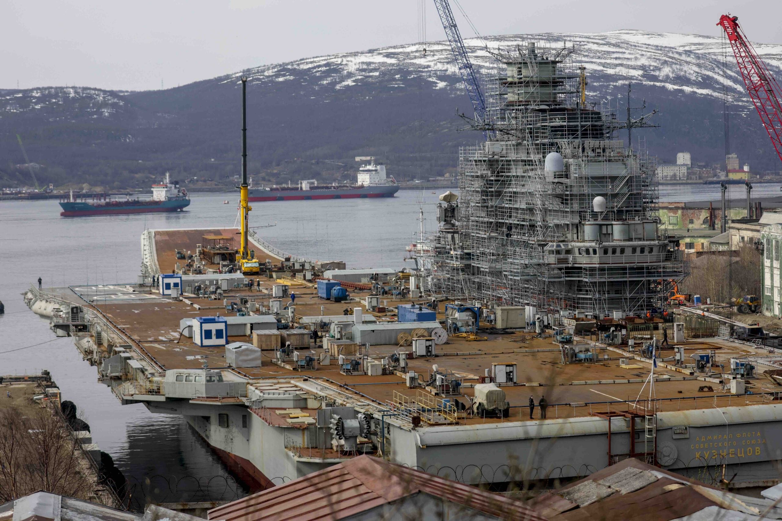 MURMANSK, RUSSIA - MAY 20: Russian Navyâs lone aircraft carrier, the Admiral Flota Sovetskogo Soyuza Kuznetsov, is towed to the 35th squadron shipyard for maintenance and repair works in Murmansk, Russia on May 20, 2022. It is aimed to be completed the maintenance and repair works by the end of 2023. (Photo by Semen Vasileyev/Anadolu Agency via Getty Images)