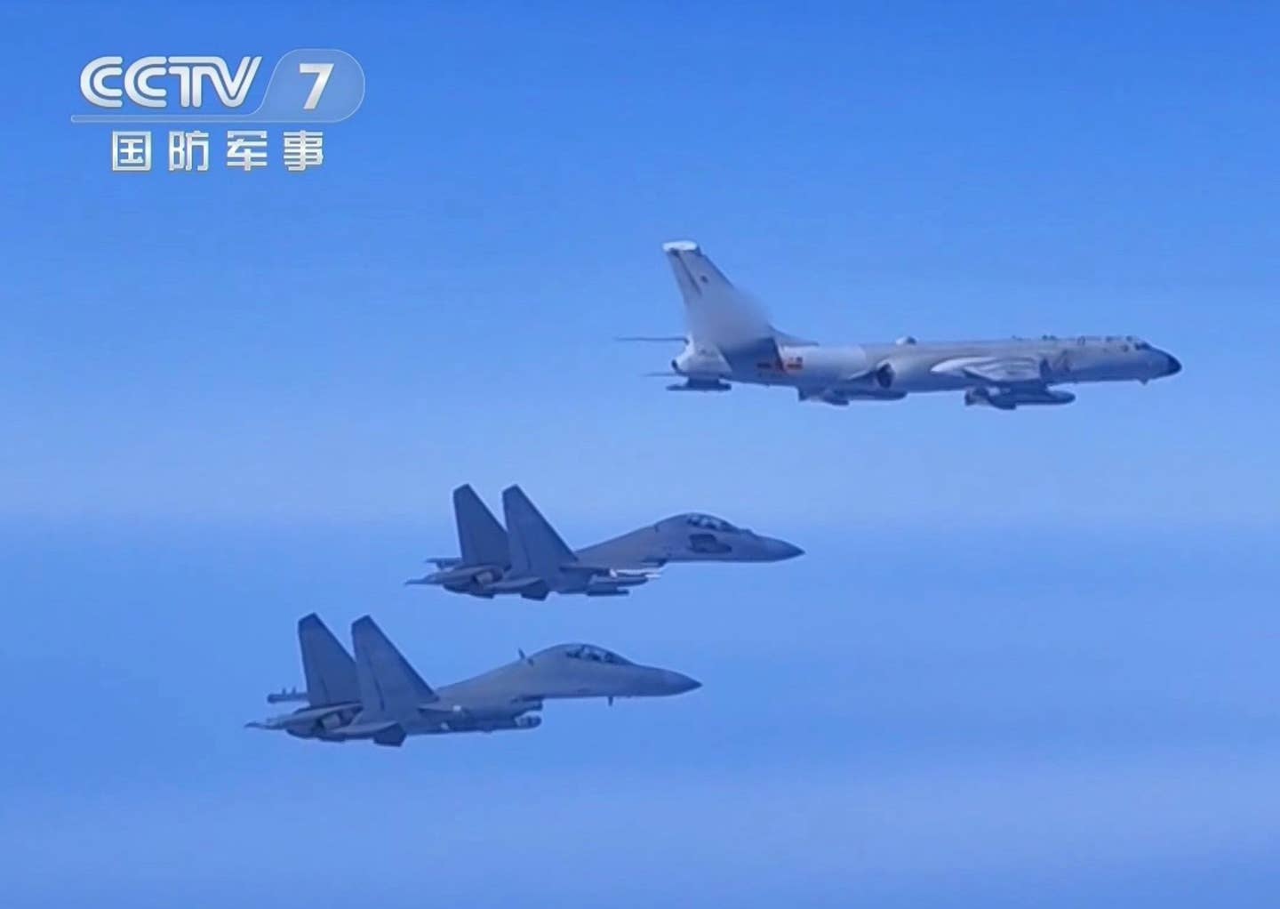 A screen capture from the latest exercise shows a PLA Air Force J-16D electronic warfare aircraft (nearest camera) and a J-16 multirole fighter escorting a missile-armed H-6KG bomber. <em>via Twitter/CCTV-7</em>