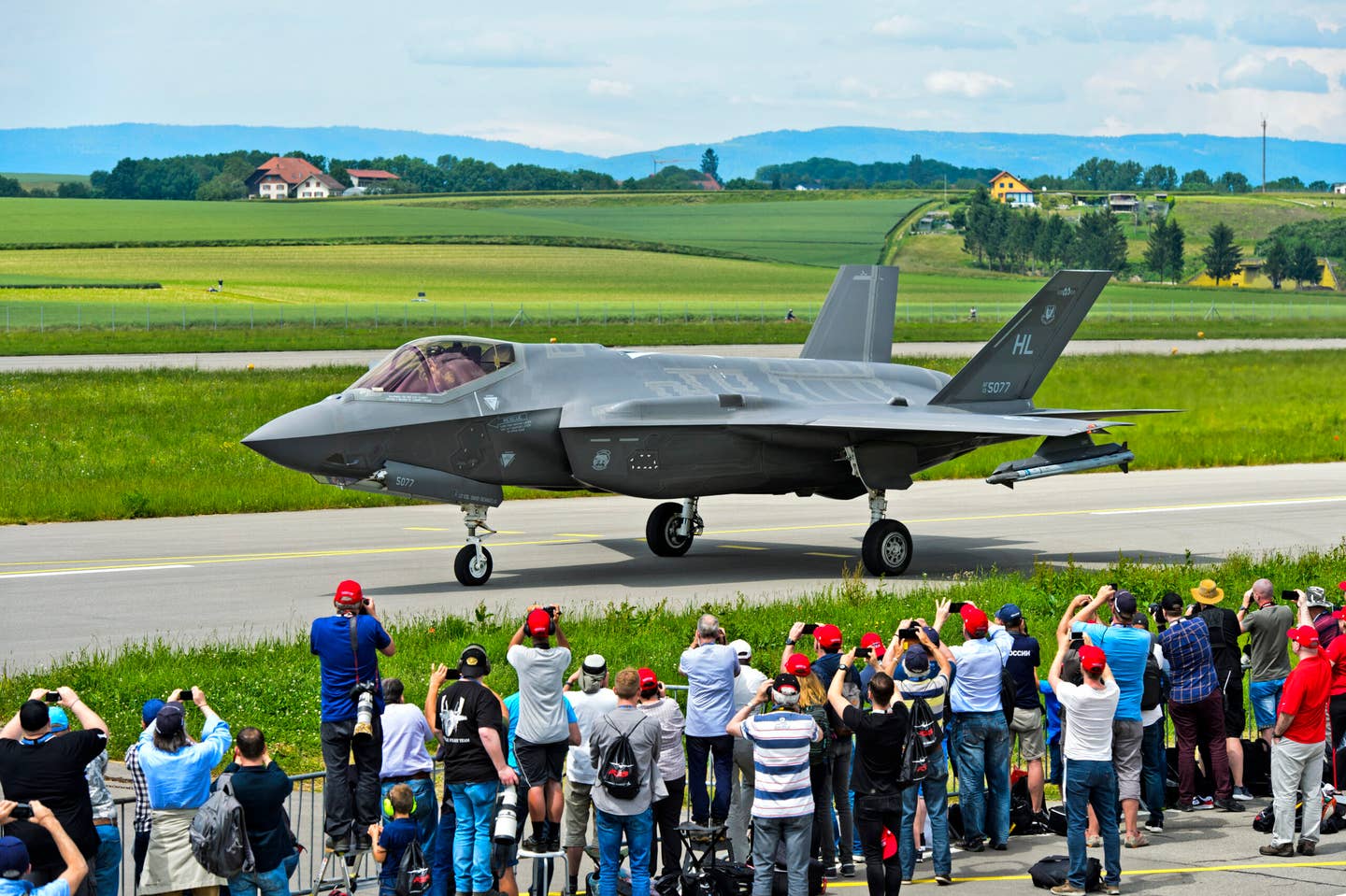 Locals welcome an F-35A of the U.S. Air Force at Payerne military airfield in 2019 in the context of the AIR2030 procurement program of the Swiss Air Force. G<em>unter Fischer/Education Images/Universal Images Group via Getty Images</em>