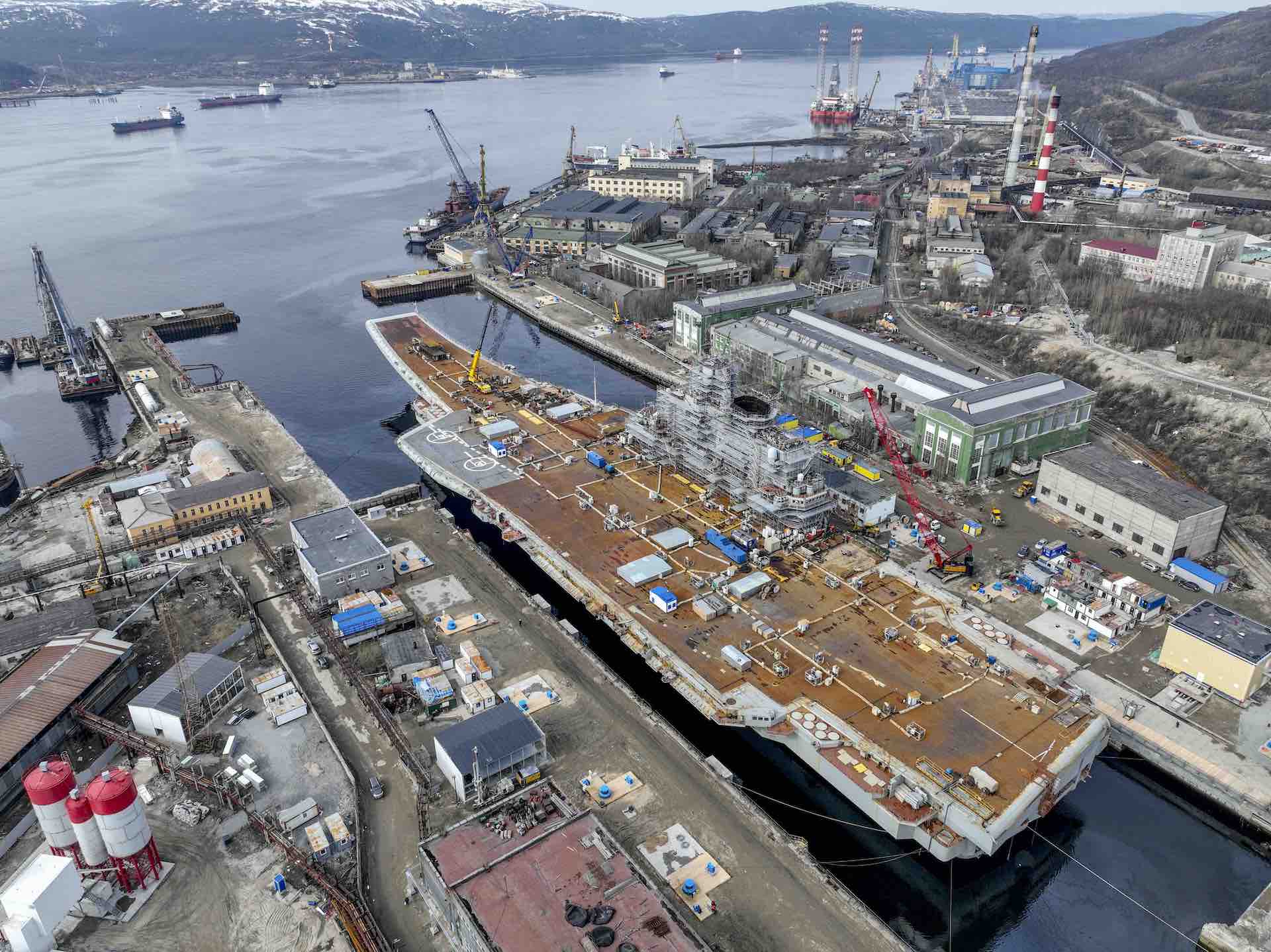 MURMANSK, RUSSIA - MAY 20: Russian Navyâs lone aircraft carrier, the Admiral Flota Sovetskogo Soyuza Kuznetsov, is towed to the 35th squadron shipyard for maintenance and repair works in Murmansk, Russia on May 20, 2022. It is aimed to be completed the maintenance and repair works by the end of 2023. (Photo by Semen Vasileyev/Anadolu Agency via Getty Images)