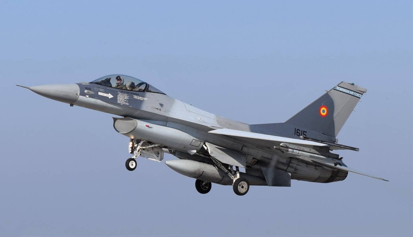 A Romanian Air Force F-16AM lands at the 86th Air Base in Borcea, Romania, in October 2021. <em>U.S. Air Force photo by Capt. Andrew Layton</em>