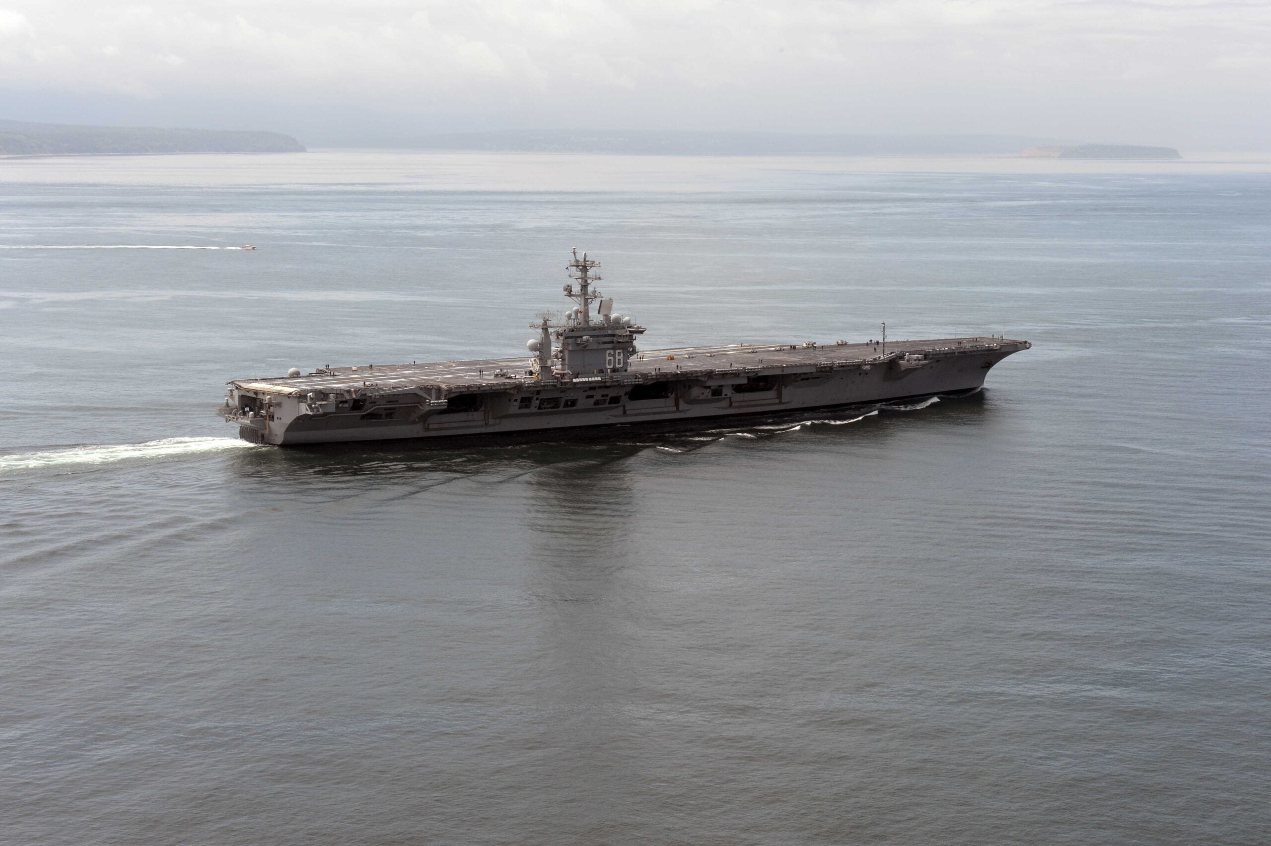 The aircraft carrier USS Nimitz (CVN 68) transits the Strait of Juan de Fuca in Washington June 13, 2014. The Nimitz was underway hosting a friends and family day where nearly 400 civilian guests joined the ship's crew for a one-day underway. (U.S. Navy photo by Mass Communication Specialist 2nd Class John Hetherington/Released)