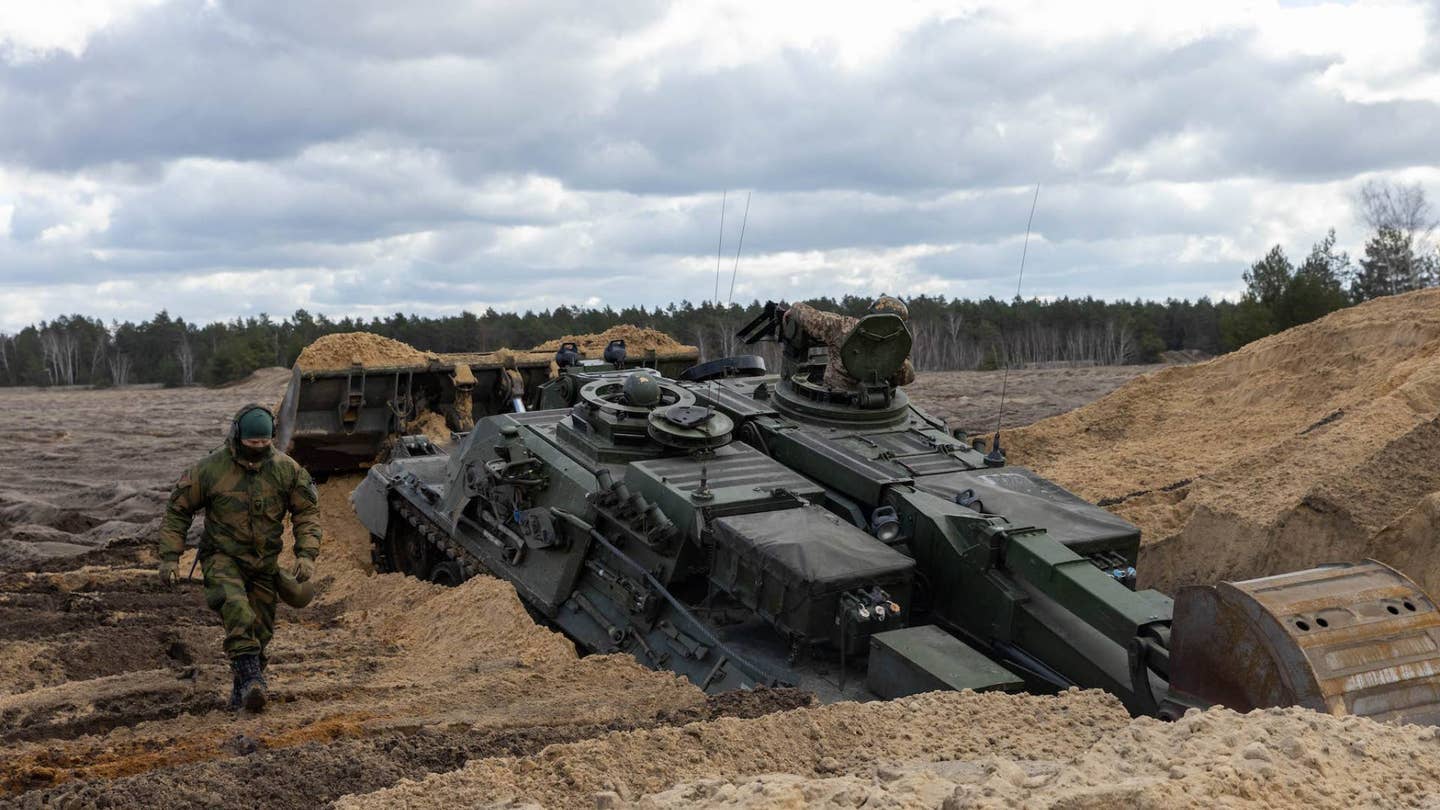 Ukrainian soldiers train to build tank obstacles in one of the Norwegian engineer armored vehicles.&nbsp;<br>(Norwegian Armed Forces photo)