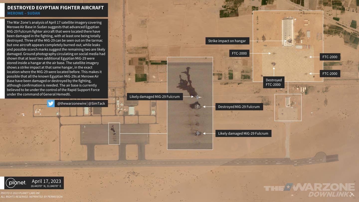 <em>The War Zone</em>’s analysis of April 17 satellite imagery covering Merowe Air Base in Sudan suggests that advanced Egyptian MiG-29 Fulcrum fighter aircraft that were located there have been damaged in the fighting, with at least one being totally destroyed. Three of the MiG-29 can be seen out on the tarmac but one aircraft appears completely burned out, while leaks and possible scorch marks suggest the remaining two are likely damaged. Ground photography circulating on social media had shown that at least two additional Egyptian MiG-29 were stored inside a hangar at the air base. The satellite imagery shows a strike impact at that same hangar, in the exact location where the MiG-29s were located before. This makes it possible that all the known Egyptian MiG-29s at Merowe Air Base have been damaged or destroyed by the fighting, although confirmation is needed. The air base is currently believed to be under the control of the Rapid Support Force under the command of General Hemedti. <em>Photo via Planet Labs Inc. All Rights Reserved Reprinted With Permission</em>