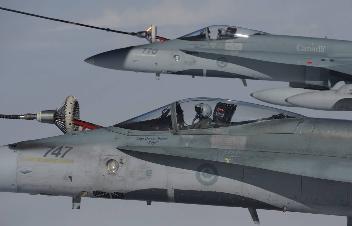 CF-18 Hornet fighters from 409 Squadron in Cold Lake, Alberta, are refueled in the air during Exercise Vigilant Eagle 13 in August 2013. <em>RCAF</em>