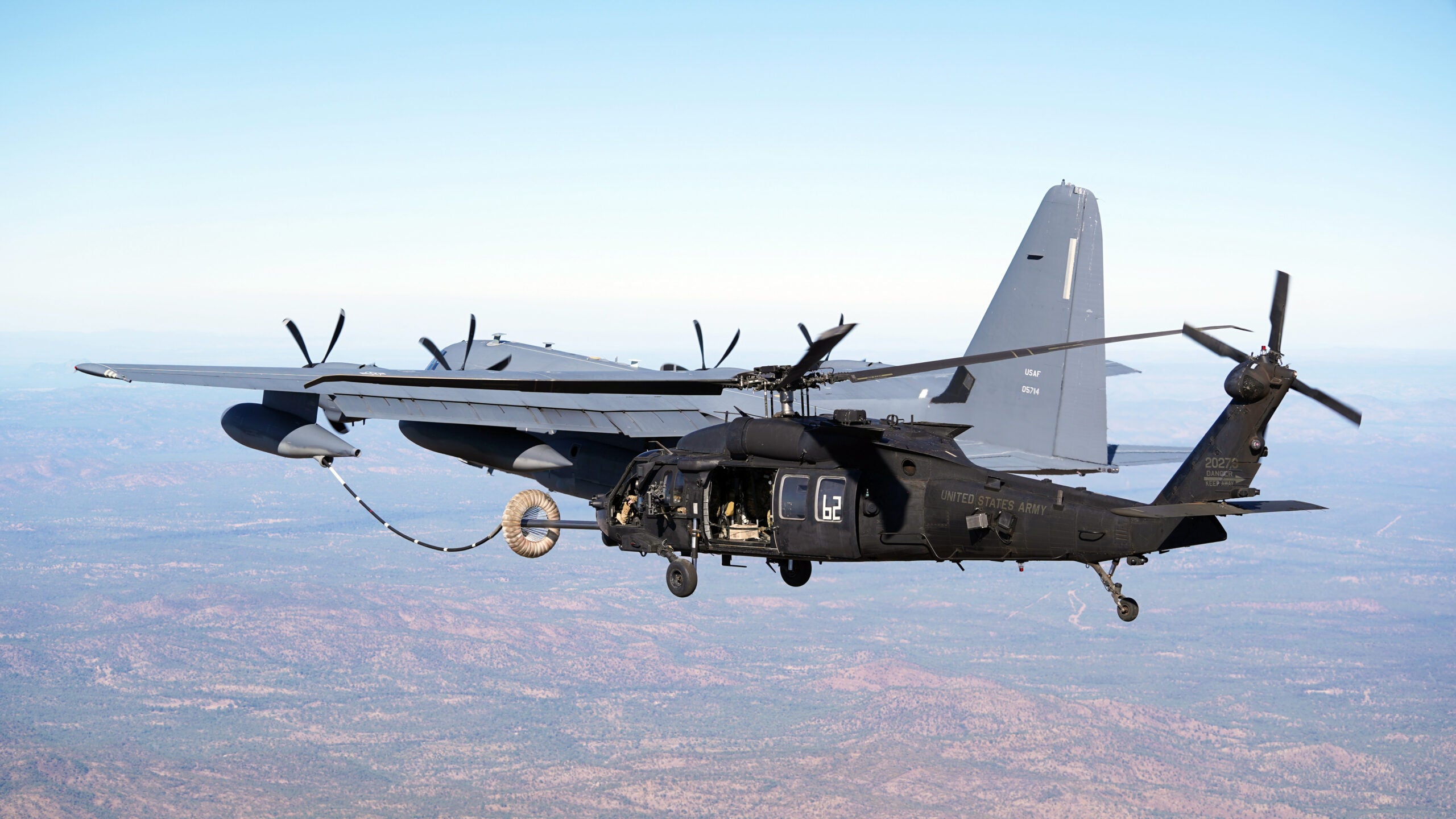 An MC-130J Air Commando II conducts helicopter air-to-air refueling with an MH-60 Black Hawk, both supporting Special Operations Command Pacific, during Talisman Sabre 21 above Queensland, Australia, July 26, 2021. TS21 is Australia’s largest military exercise with the U.S. and is a demonstration of the strong alliance underpinned by deep levels of cooperation and trust built over decades of operating and training together. (U.S. Air Force photo by 1st Lt. Joshua Thompson)