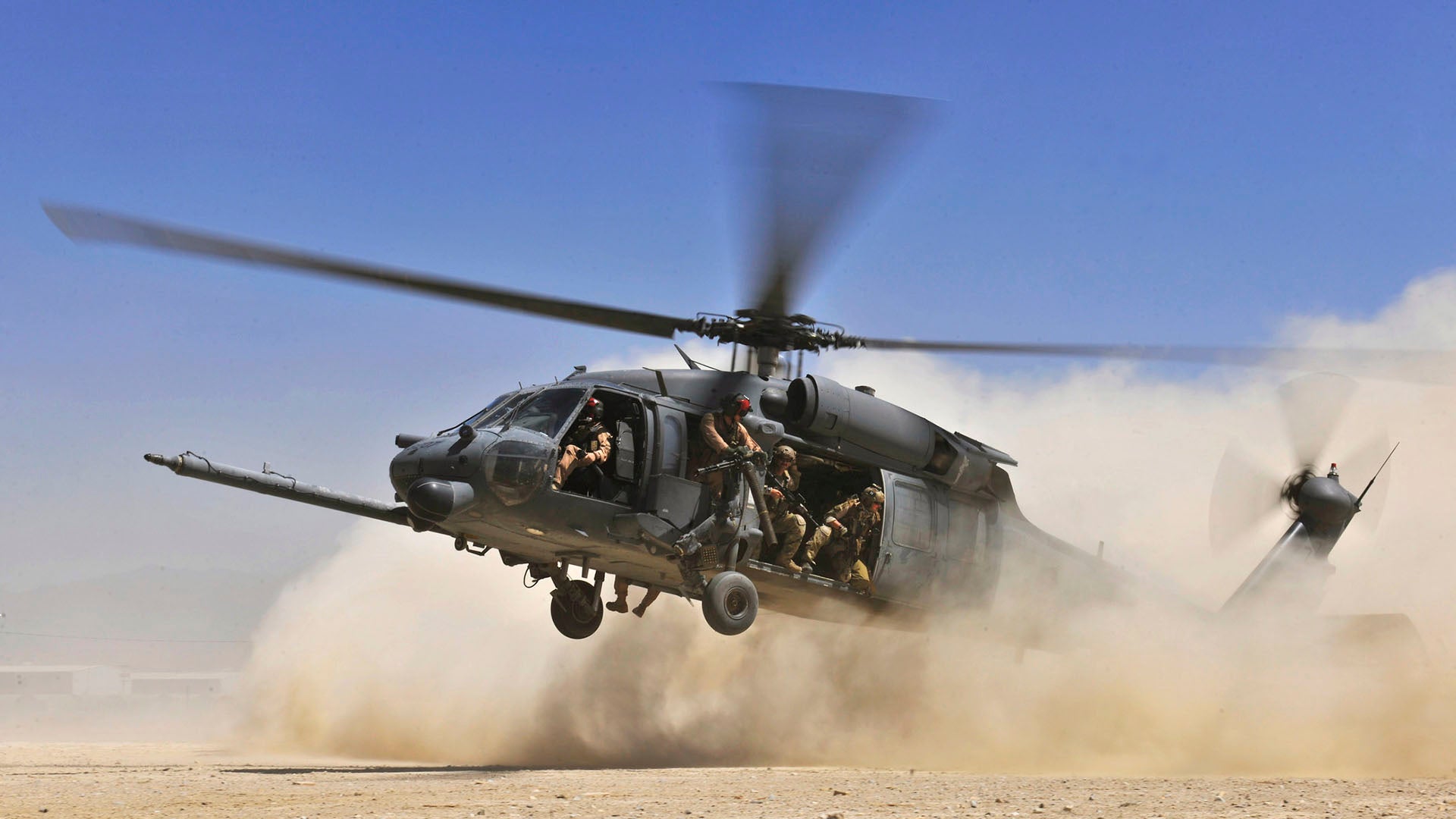 An HH-60G Pave Hawk helicopter carrying combat search and rescue Airmen approaches a landing zone during an exercise at Bagram Airfield, Afghanistan, Aug. 21. 2010. The exercise tested the rescue squadron’s ability to provide medical aid to U.S. and coalition forces. (U.S. Air Force photo/Staff Sgt. Christopher Boitz)