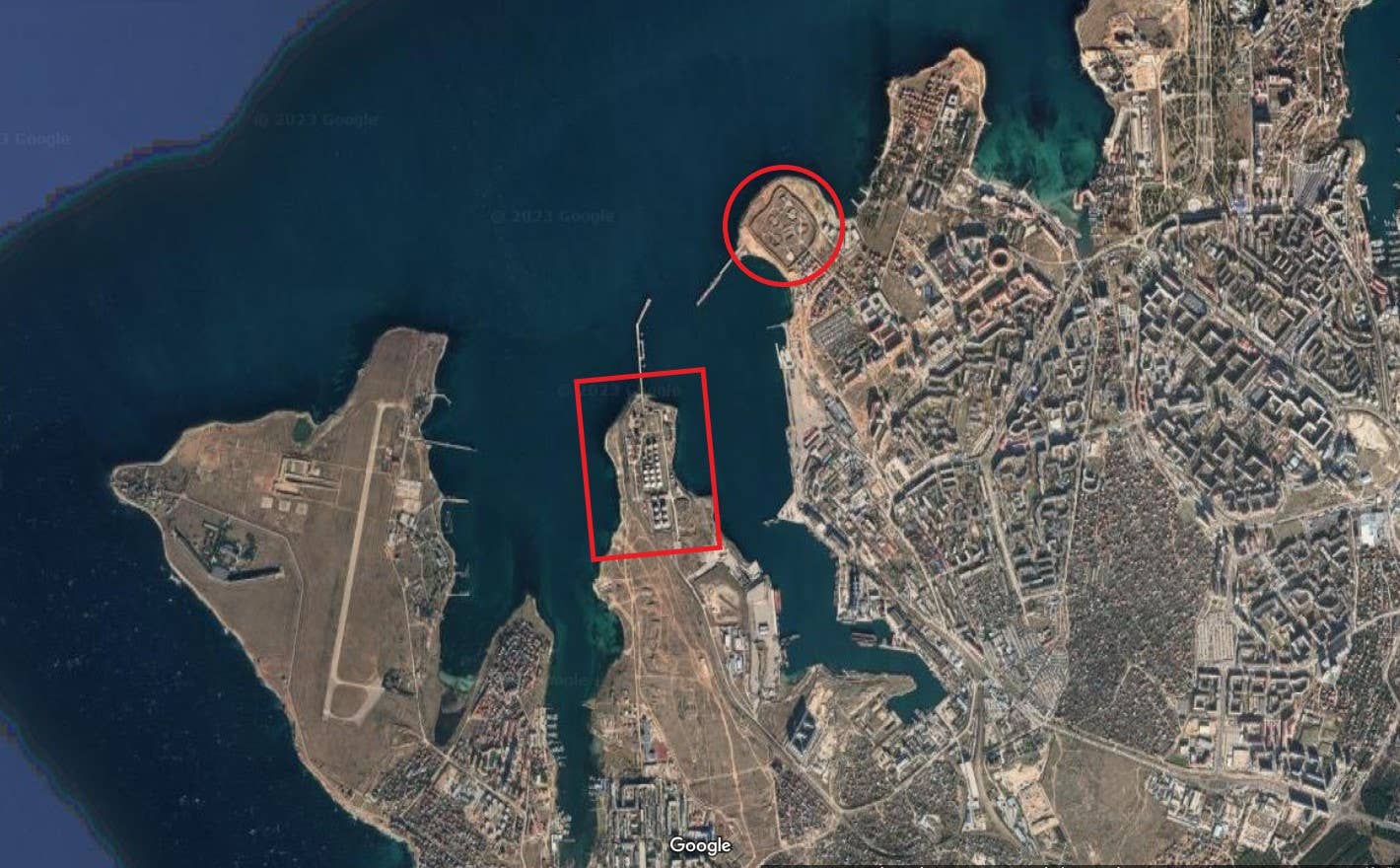 Several Russian military facilities surround the targeted fuel depot, among them the 810th Guards Naval Infantry Brigade's garrisons to the south and west, and the missile site to the northeast across the bay. <em>Google Maps</em>.