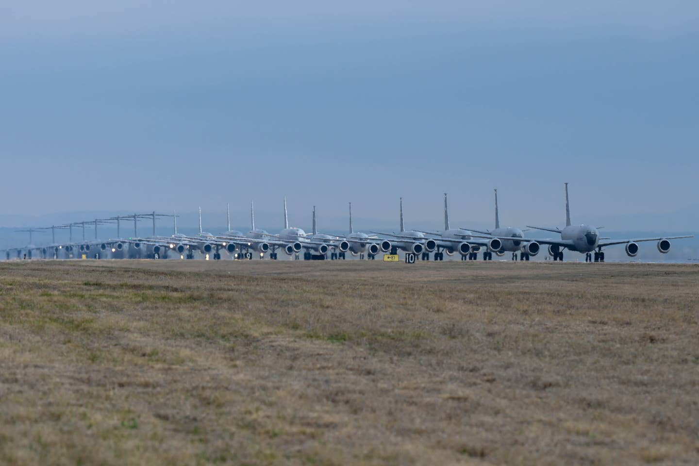 C-17s, KC-135s, and KC-46s line up for the elephant walk at Altus Air Force Base, Oklahoma, on March 24. <em>U.S. Air Force photo by Senior Airman Trenton Jancze</em>