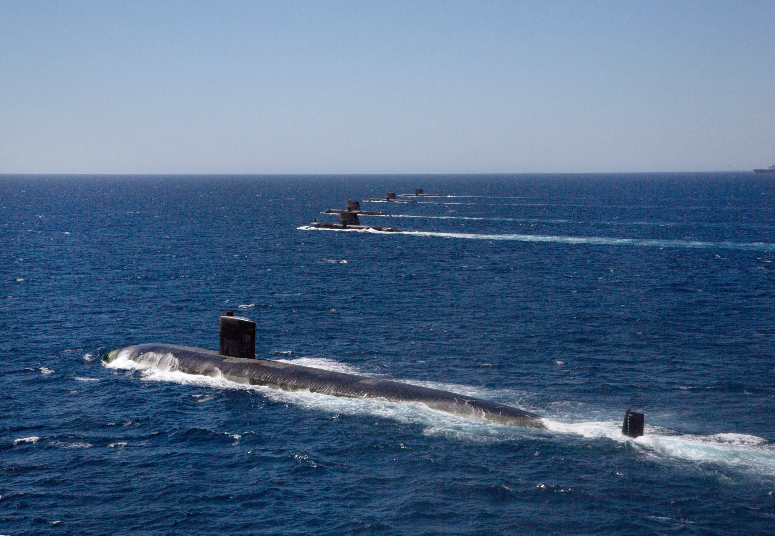 United States Navy Submarine USS Santa Fe transits in formation on the surface with Royal Australian Navy Collins Class Submarines HMAS Collins, HMAS Farncomb, HMAS Dechaineux and HMAS Sheean in the West Australian Exercise Area. *** Local Caption *** Royal Australian Navy Collins Class Submarines HMAS Collins, HMAS Farncomb, HMAS Dechaineux and HMAS Sheean were joined in formation by United States Navy Submarine USS Santa Fe in the West Australian Exercise Area for a photo opportunity in February 2019. The submarines were in the area to participate in several activities, including Exercise Lungfish 2019 and Exercise Ocean Explorer 2019.