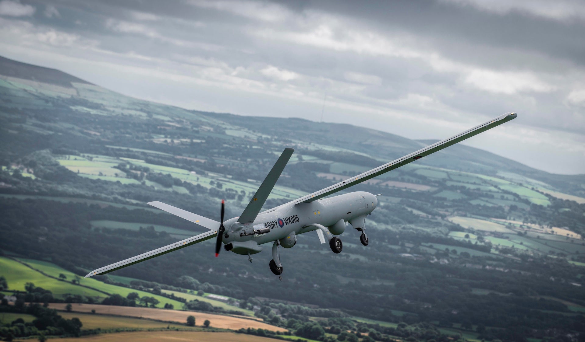 A Watchkeeper WK450 Remotely Piloted Air System RPAS in flight over the UK during a test flight.  

Watchkeeper is an unmanned aerial vehicle (UAV) for all weather, Intelligence, Surveillance, Target Acquisition and Reconnaissance (ISTAR).

Watchkeeper provides enhanced UAV capability that will enable commanders to detect and track targets for long periods, without the need to deploy troops into potentially sensitive or dangerous areas. The system is capable of rapid deployment and operations anywhere in the world and will support the information requirements of all three services.