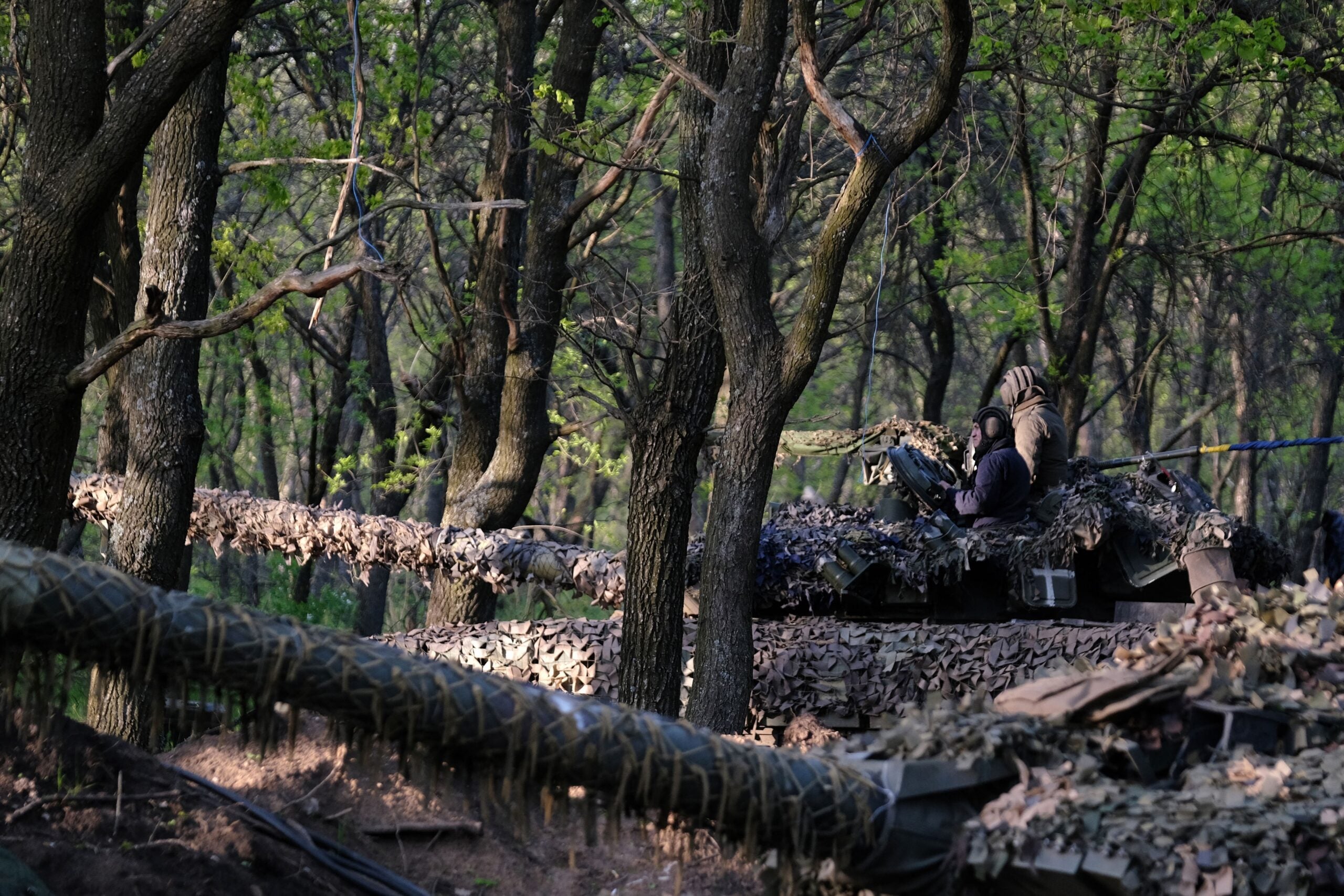 TOPSHOT - Ukrainian servicemen of the Adam tactical group ride a T-64 tank from a front line near the town of Bakhmut, Donetsk region, on May 7, 2023, amid the Russian invasion of Ukraine. (Photo by Sergey SHESTAK / AFP) (Photo by SERGEY SHESTAK/AFP via Getty Images)