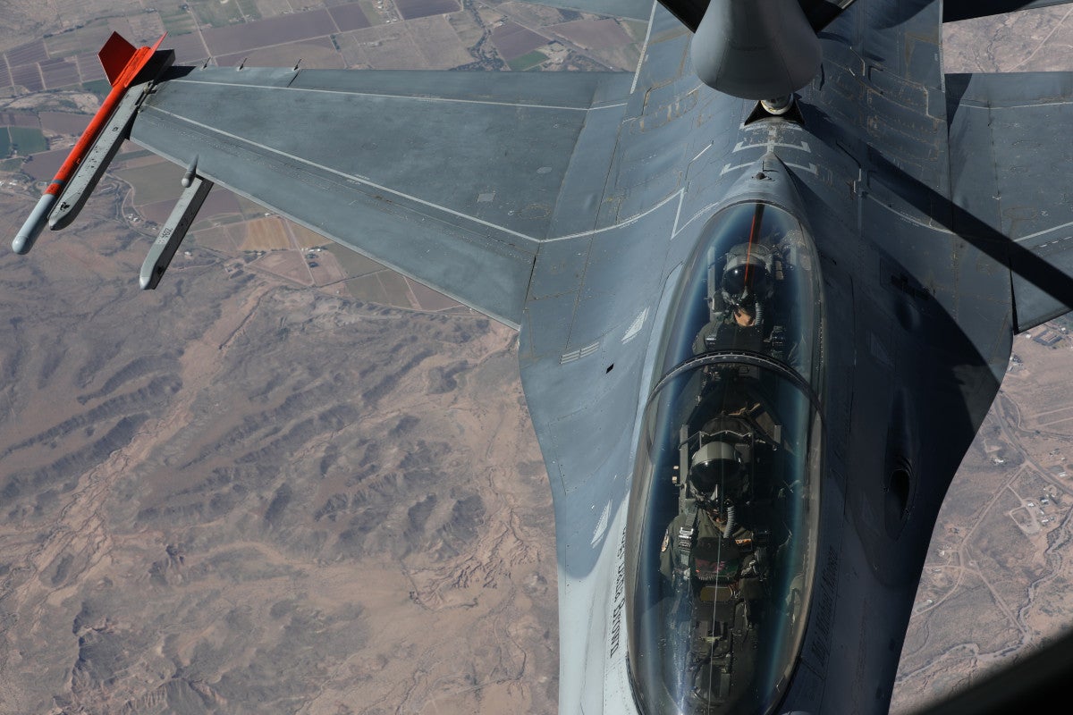 A KC-153 from the 161st Air Refueling wing refuels a F-16 Fighter Jet from the 162nd Fighter Wings on May 4, 2023 in Ariz.