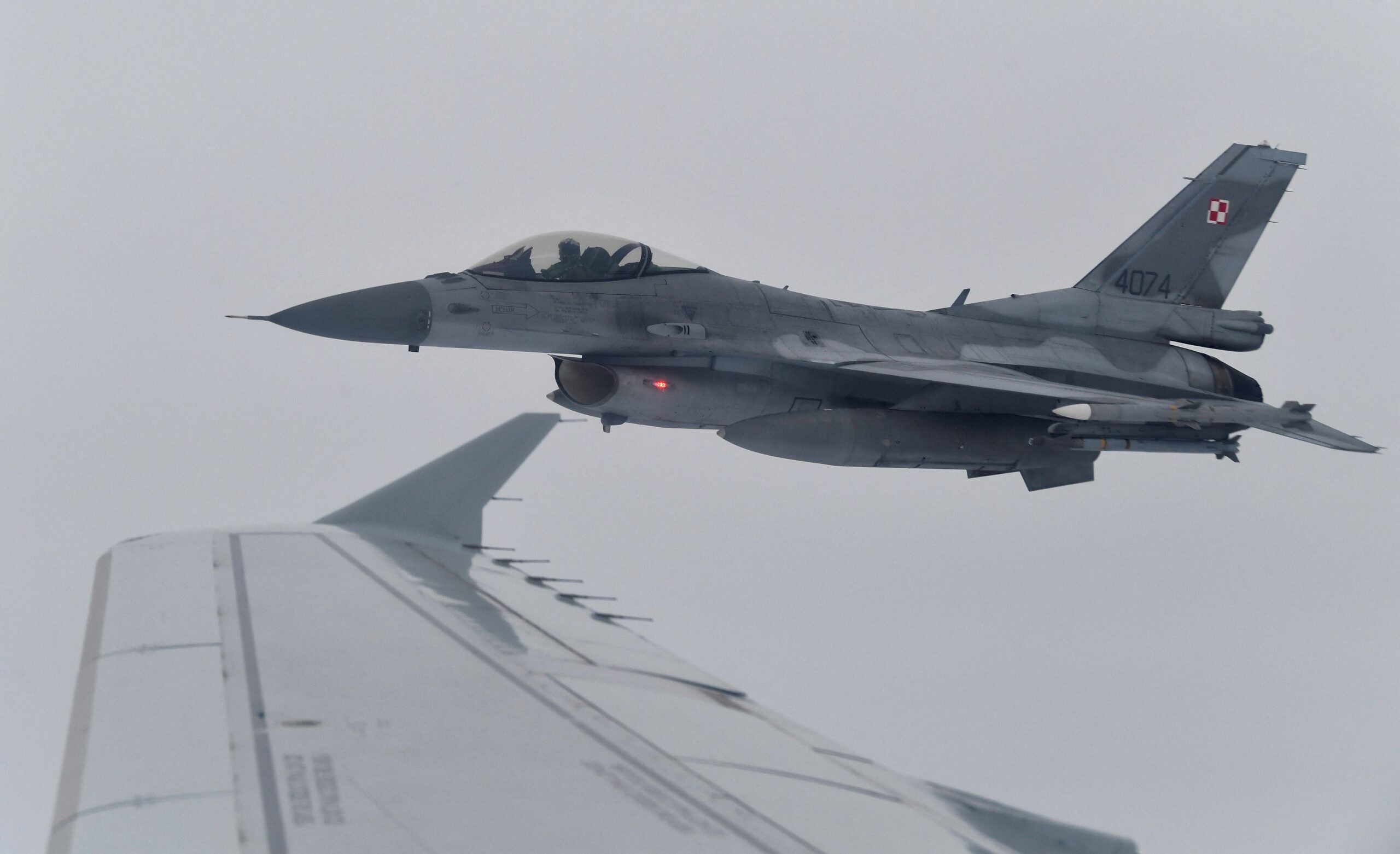 A F-16 of Polish Air Force is seen are seen during a NATOs Baltic Air Policing drill simulating an interception of a civilian flight near Siauliai airport in Lithuania, on January 14, 2020. (Photo by John THYS / AFP) (Photo by JOHN THYS/AFP via Getty Images)