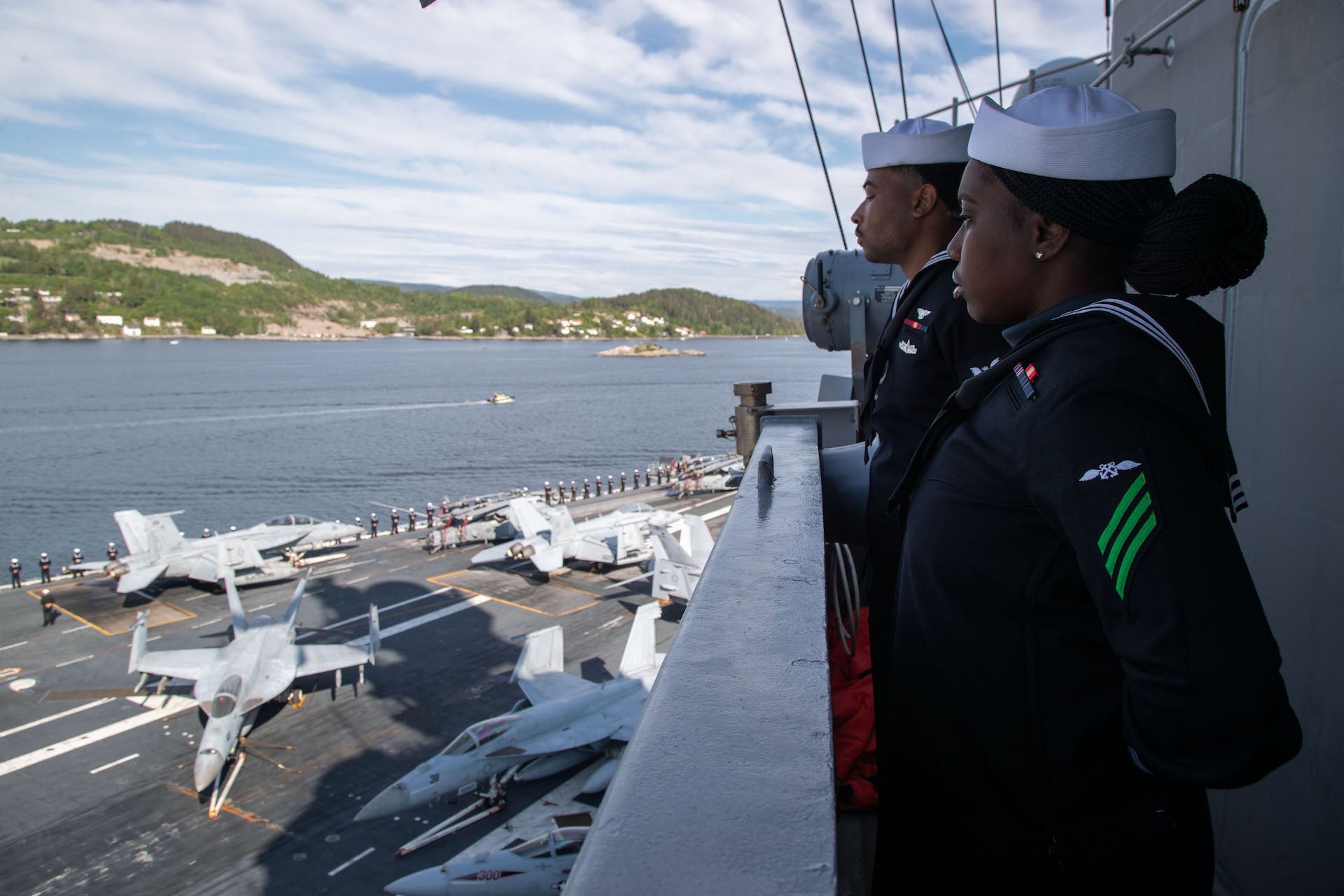 The flagship USS Gerald R. Ford (CVN 78) transits the Oslo fjord for its first port call in Oslo, Norway, May 24, 2023. Gerald R. Ford is the first U.S. aircraft carrier to pull into Norway in more than 65 years. Gerald R. Ford is the U.S. Navy’s newest and most advanced aircraft carrier, representing a generational leap in the in the U.S. Navy’s capacity to project power on a global scale. The Gerald R. Ford Strike Group is on a scheduled deployment in the U.S. Naval Forces Europe area of operations, employed by U.S. Sixth Fleet to defend U.S., allied, and partner interest. (US Navy Photo by Mass Communication Specialist 2nd Class Brian Glunt) Released