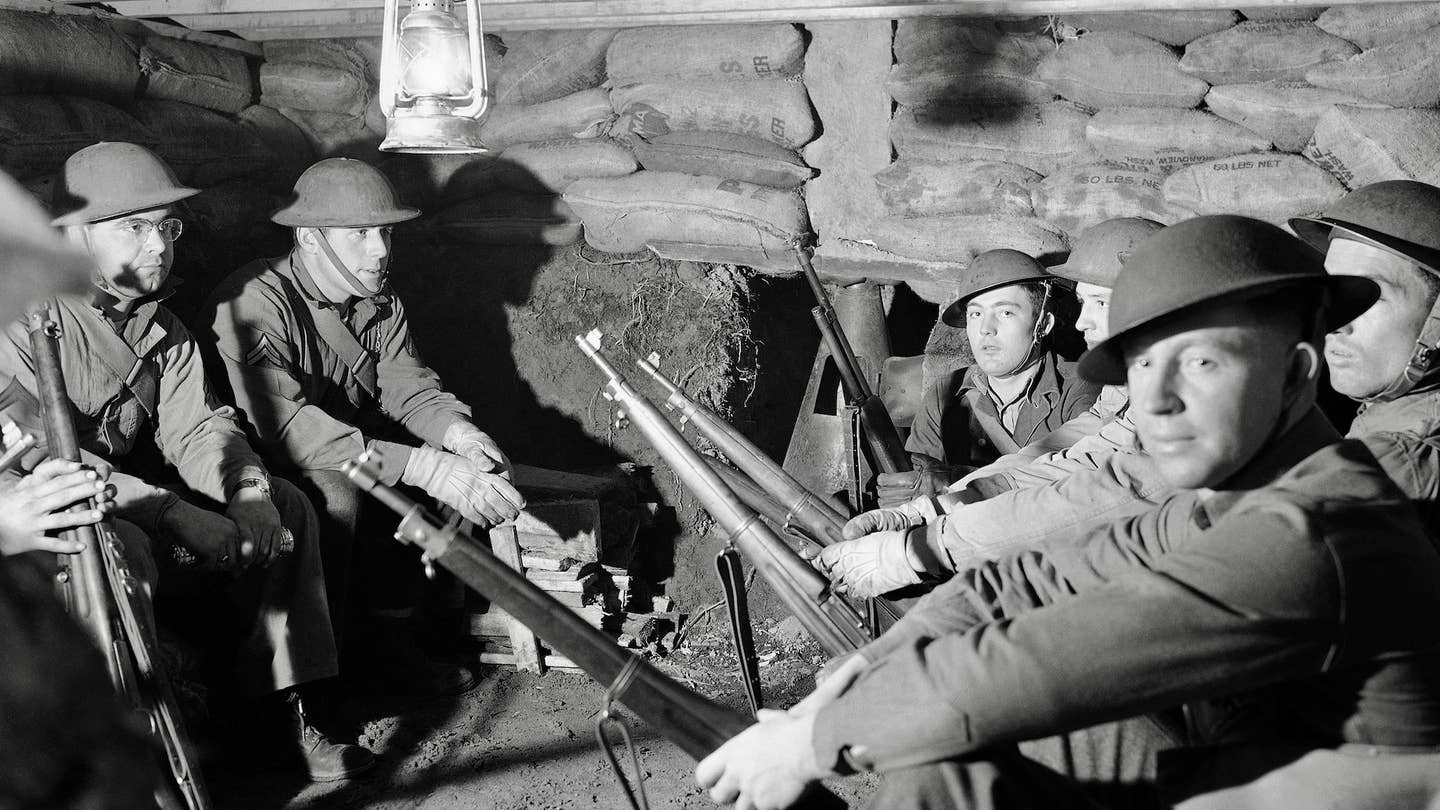 Anti-aircraft troops who guard the Pacific Northwest are resting in a comfortable underground bombproof shelter on Jan. 19, 1942, as they wait a call to man their large anti-aircraft gun. Specific location is unknown.