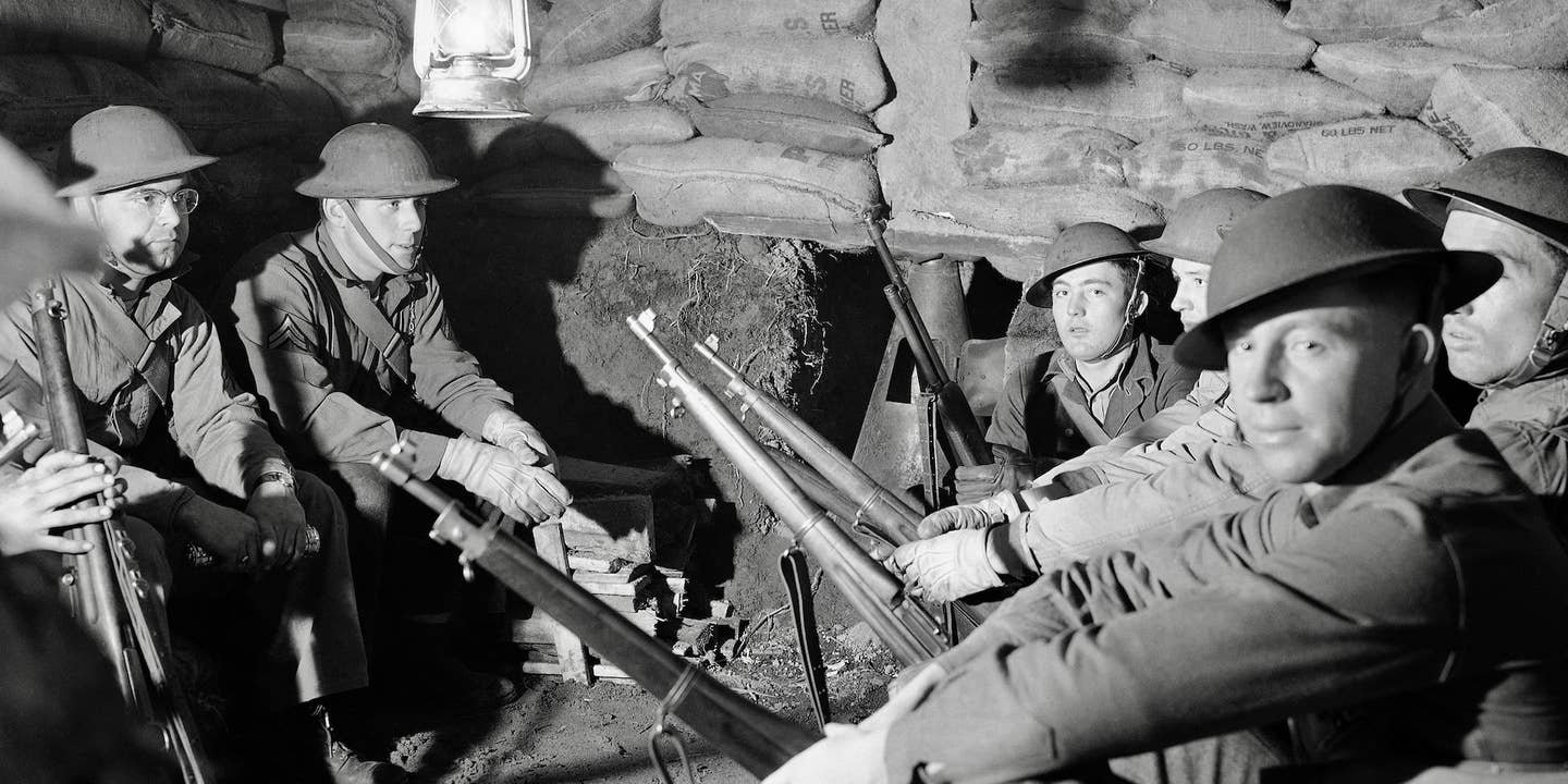 Anti-aircraft troops who guard the Pacific Northwest are resting in a comfortable underground bombproof shelter on Jan. 19, 1942, as they wait a call to man their large anti-aircraft gun. Specific location is unknown.