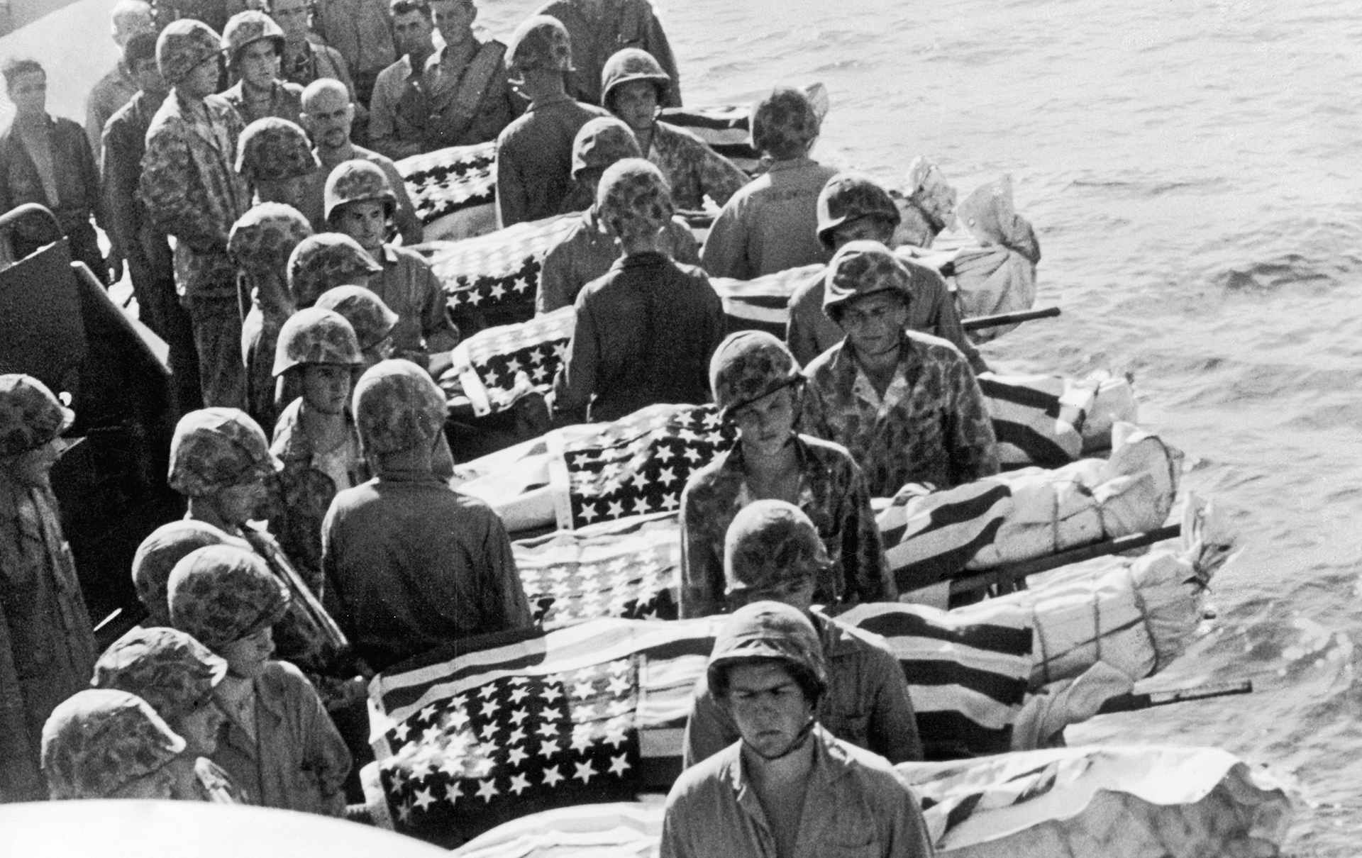 US Marine casualties of the Battle of Saipan are buried at sea, July 1944. 
