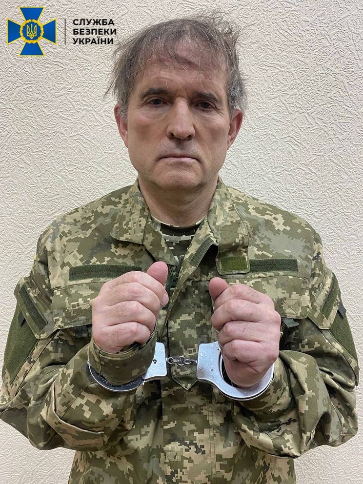 UKRAINE - APRIL 12: (----EDITORIAL USE ONLY â MANDATORY CREDIT - "SECURITY SERVICE OF UKRAINE / HANDOUT" - NO MARKETING NO ADVERTISING CAMPAIGNS - DISTRIBUTED AS A SERVICE TO CLIENTS----) Fugitive oligarch and Russian President Vladimir Putin's close friend Viktor Medvedchuk is seen handcuffed after a special operation was carried out by Security Service of Ukraine in Ukraine on April 12, 2022. (Photo by Security Service of Ukraine/Anadolu Agency via Getty Images)