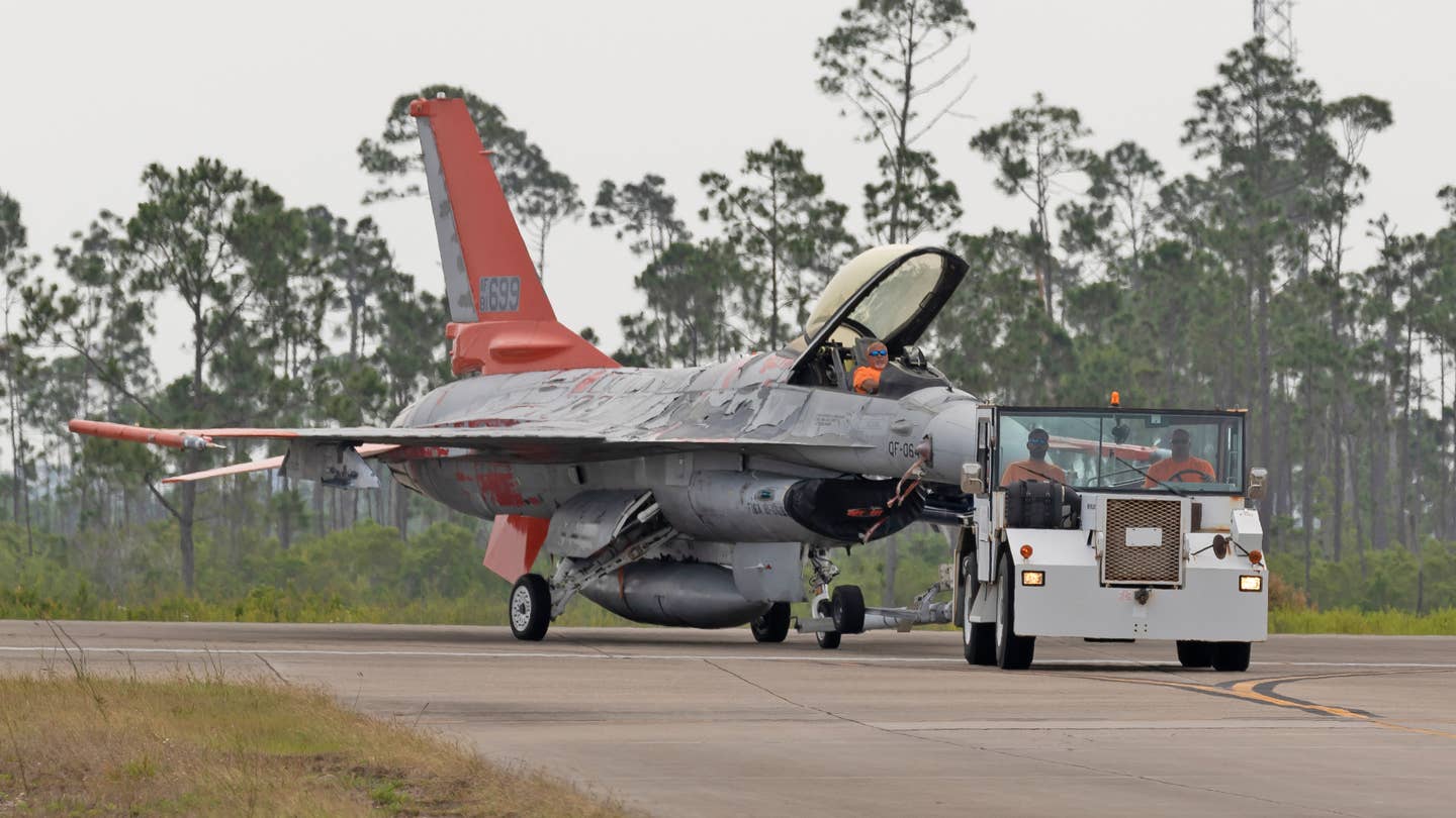 A QF-16 earmarked for destruction is towed to the droneway at Tyndall AFB. <em>Richard Collens</em>