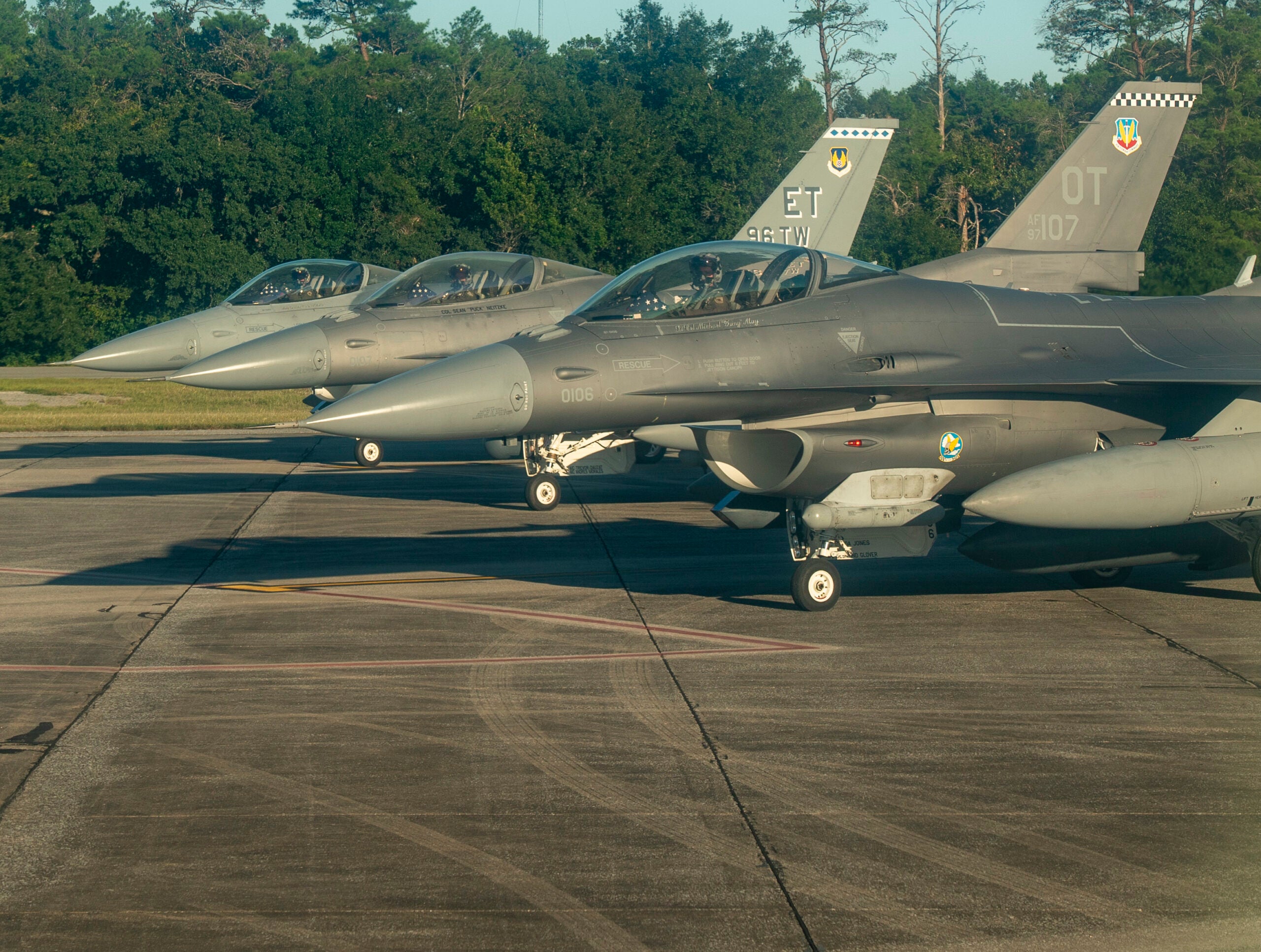 Three F-16s from Eglin Air Force Base prepare for takeoff before flying over two football games at Niceville, Fla. And Crestview, Fl., Sept. 24, 2021.  The Okaloosa County Schools held a Prisoner of War/Missing In Action remembrance ceremony prior to kick-off. (U.S. Air Force photo by Master Sgt. Tristan McIntire)