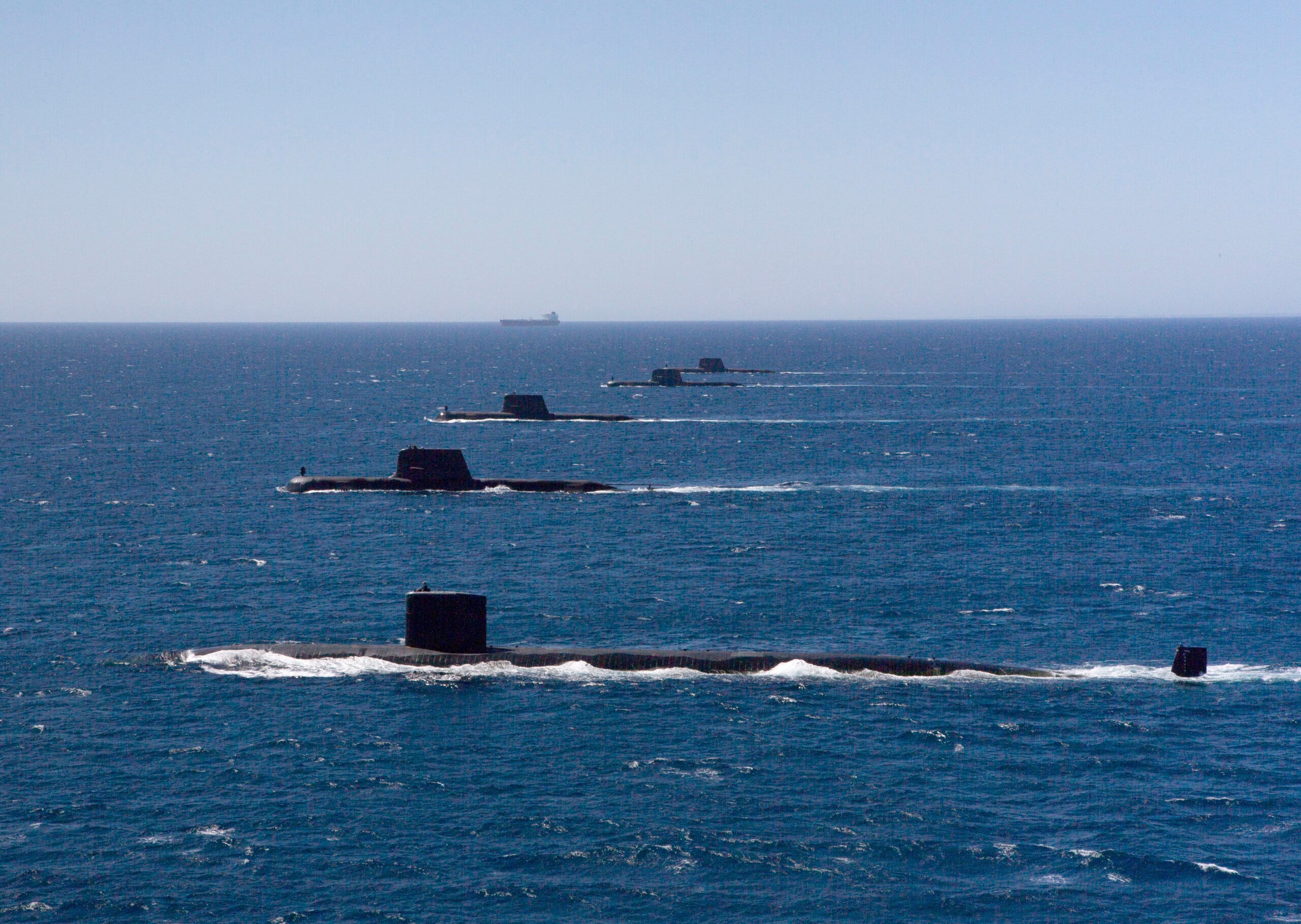 United States Navy Submarine USS Santa Fe transits in formation on the surface with Royal Australian Navy Collins Class Submarines HMAS Collins, HMAS Farncomb, HMAS Dechaineux and HMAS Sheean in the West Australian Exercise Area. *** Local Caption *** Royal Australian Navy Collins Class Submarines HMAS Collins, HMAS Farncomb, HMAS Dechaineux and HMAS Sheean were joined in formation by United States Navy Submarine USS Santa Fe in the West Australian Exercise Area for a photo opportunity in February 2019. The submarines were in the area to participate in several activities, including Exercise Lungfish 2019 and Exercise Ocean Explorer 2019.