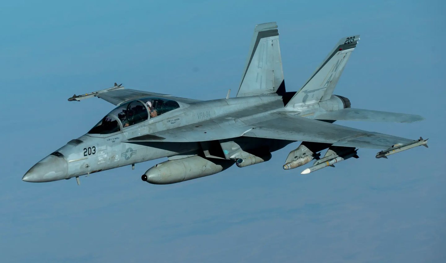 Equipped with an IRST pod, a U.S. Navy F/A-18F flies over the U.S. Central Command area of responsibility during a mission in support of Operation Inherent Resolve, September 30, 2020. <em>U.S. Air Force photo by Staff Sgt. James Merriman</em><br>