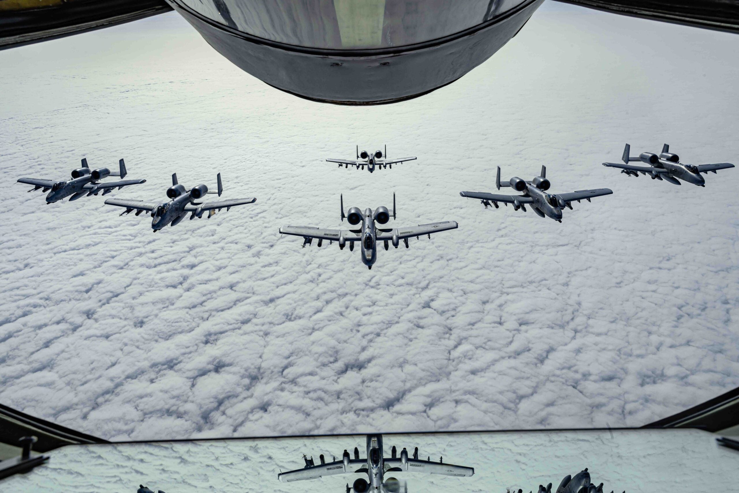 A U.S. Air Force A-10 Thunderbolt II aircraft assigned to the 127th Wing, Michigan National Guard, fly in formation behind a KC-135 Stratotanker assigned to the 128th Air Refueling Wing, Wisconsin National Guard, June 5, 2023. Exercise Air Defender integrates both U.S. and Allied air-power to defend shared values, while leveraging and strengthening vital partnerships to deter aggression around the world. (U.S. Air National Guard photo by Master Sgt. Lauren Kmiec)