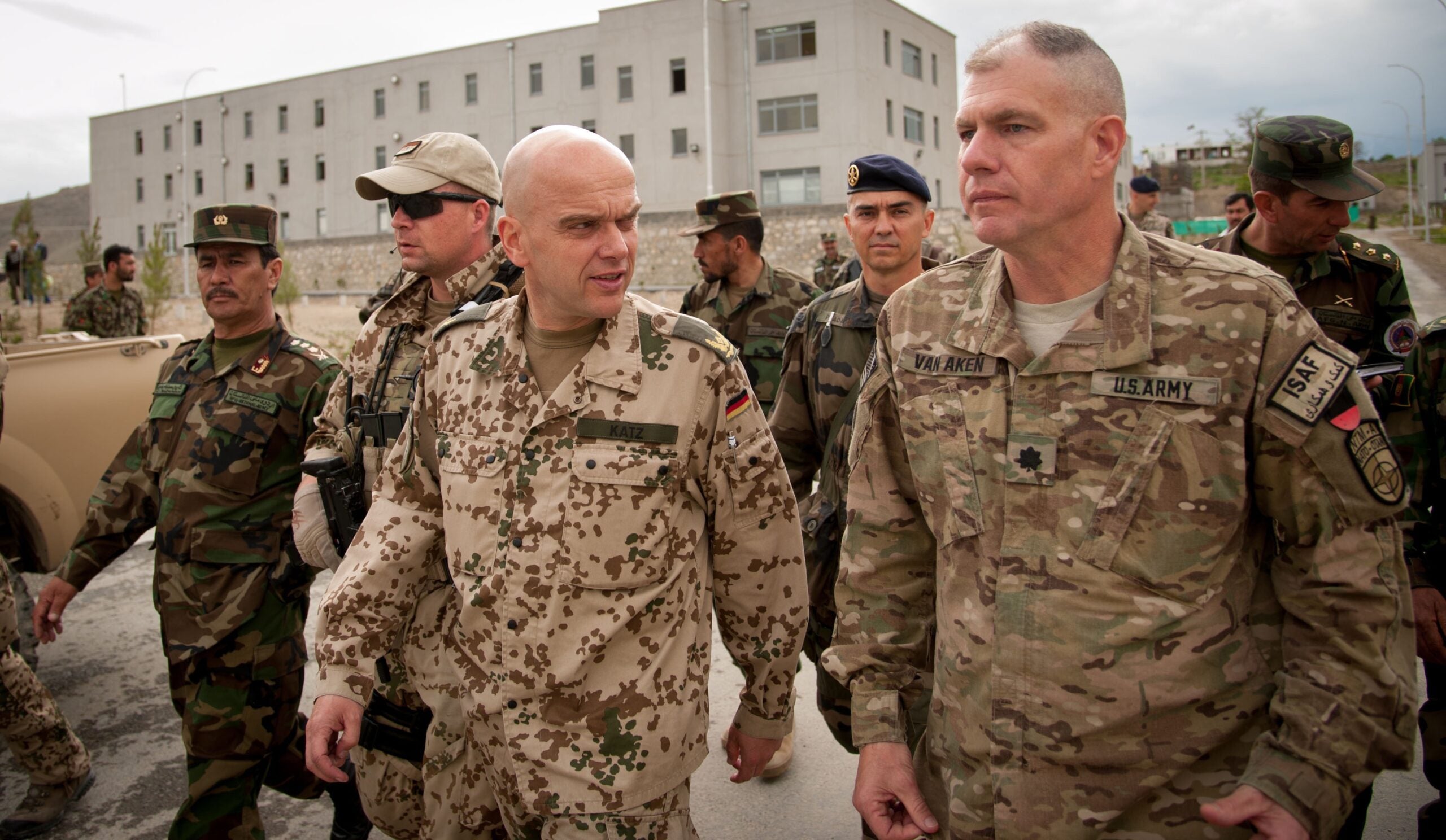 U.S. Army Lt. Col. John Van Aken, front right, accompanies German air force Brig. Gen. Gunter Katz on a walking tour around the Afghan National Defense University (ANDU) in Kabul, Afghanistan, May 7, 2013. The ANDU trained future Afghan National Army officers. (U.S. Air Force photo by Staff Sgt. Dustin Payne/Released)