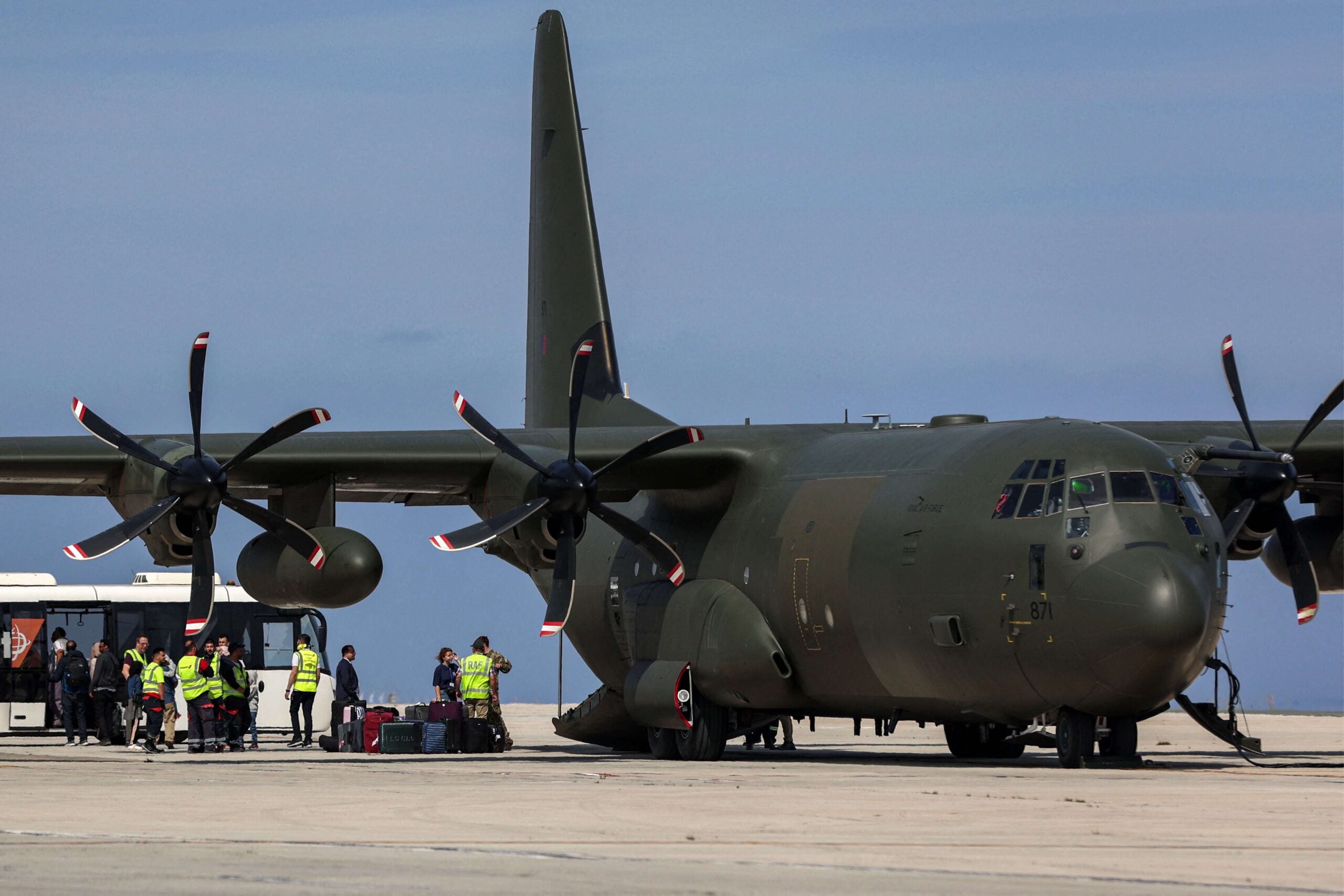 A British Royal Air Force C-130 Hercules military transport that was carrying evacuees from Sudan is pictured on the tarmac at Larnaca International Airport in Cyprus on April 26, 2023. - Multiple nations have scrambled to evacuate embassy staff and citizens by road, air and sea from chaos-torn Sudan, where fighting between the army and paramilitaries has killed hundreds. (Photo by Christina ASSI / AFP) (Photo by CHRISTINA ASSI/AFP via Getty Images)