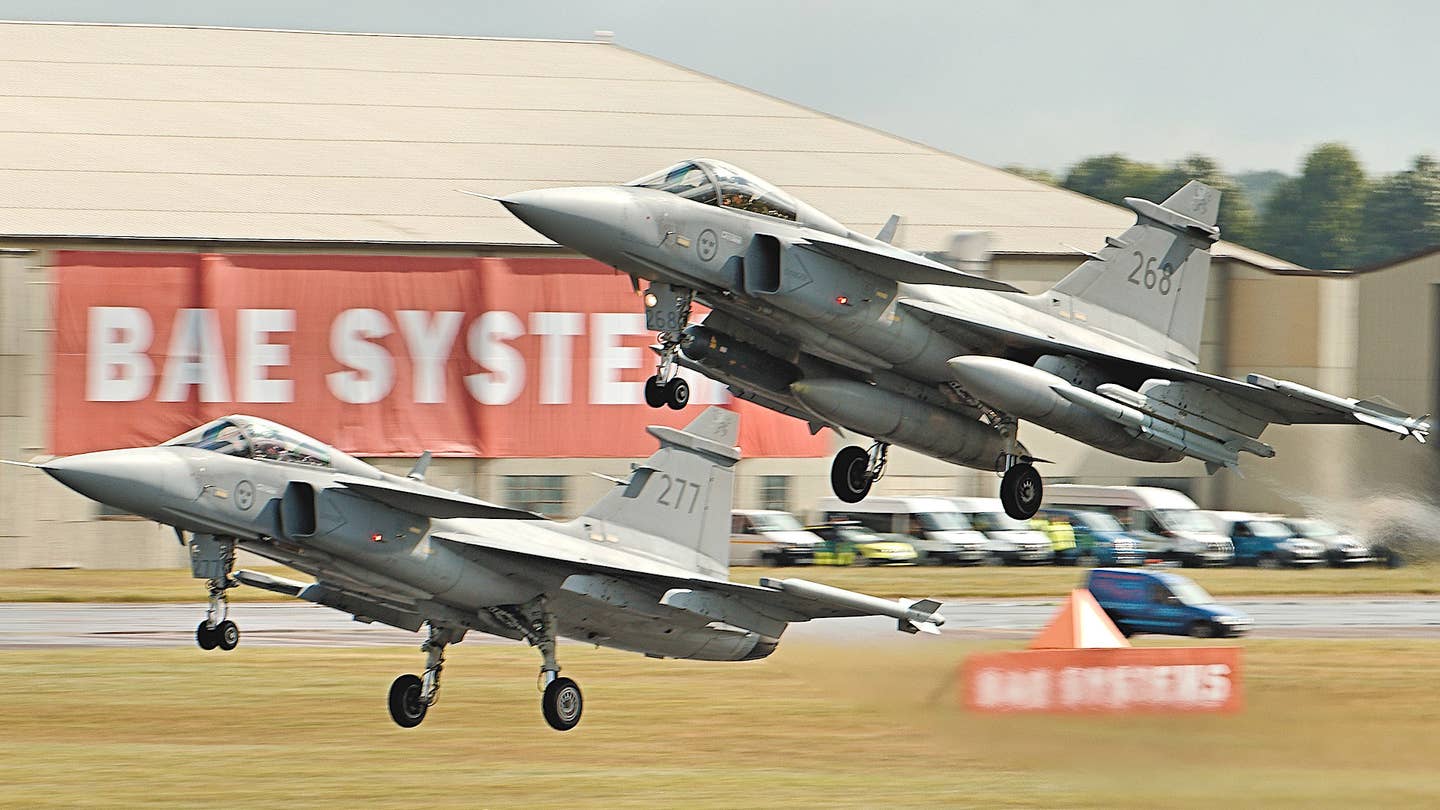 A pair of Swedish Gripen C fighter jets at the RIAT 2016 air show in the United Kingdom. <em>Airwolfhound via Wikimedia</em>