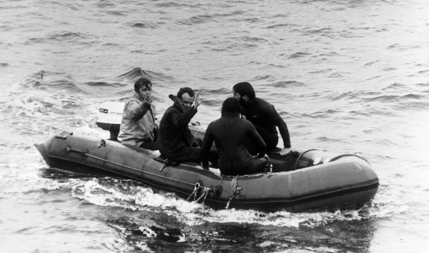 Roger Chapman (second left) waves as he is taken to the <em>Vickers Voyager</em> after being released from the <em>Pisces III</em>.   <em>Photo by PA Images via Getty Images</em>